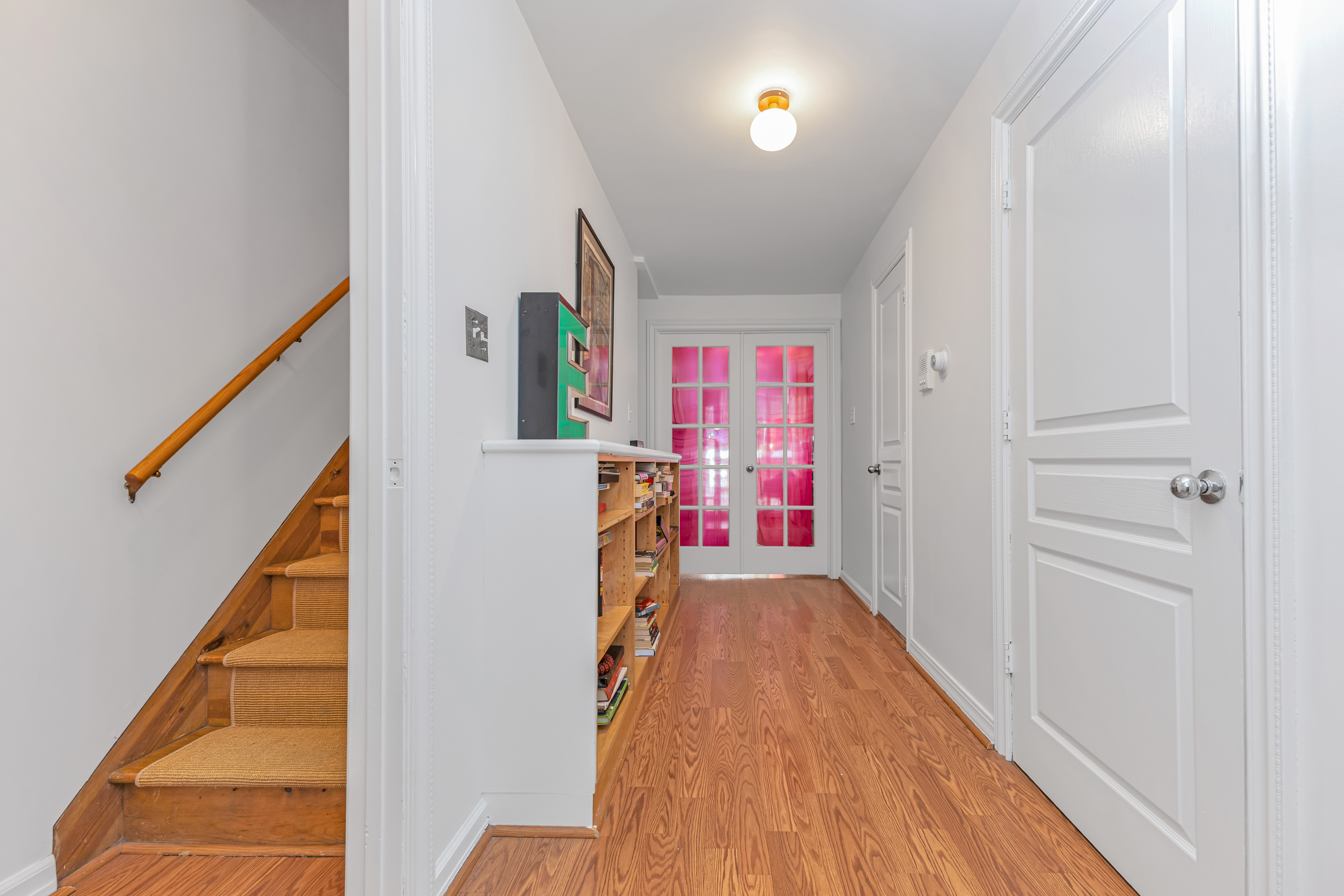 503 Clinton Street, Unit 1 Brooklyn, NY 11231 - Photo 13 of 16 a view of a hallway with wooden floor and staircase