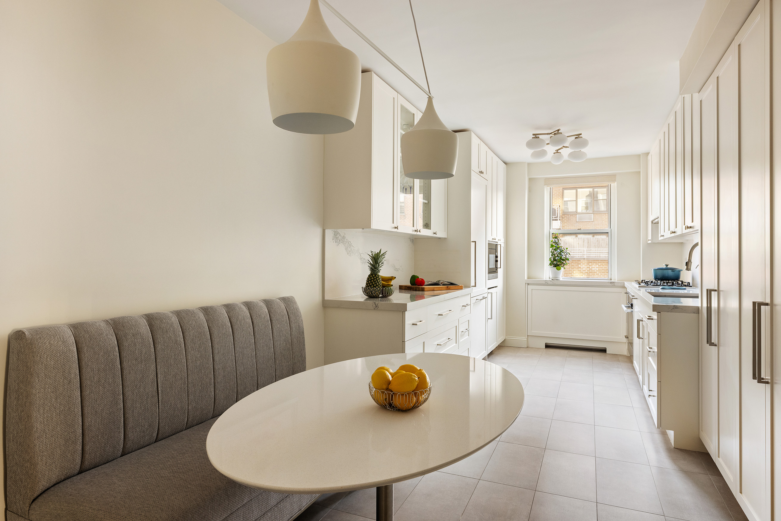 135 East 83rd Street, Unit 14B Manhattan, NY 10028 - Photo 5 of 16 a living room with furniture and a table