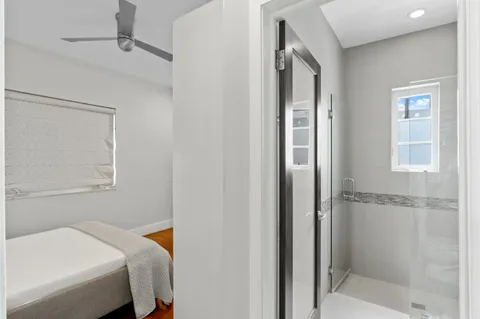 a bathroom with a bathtub and a shower