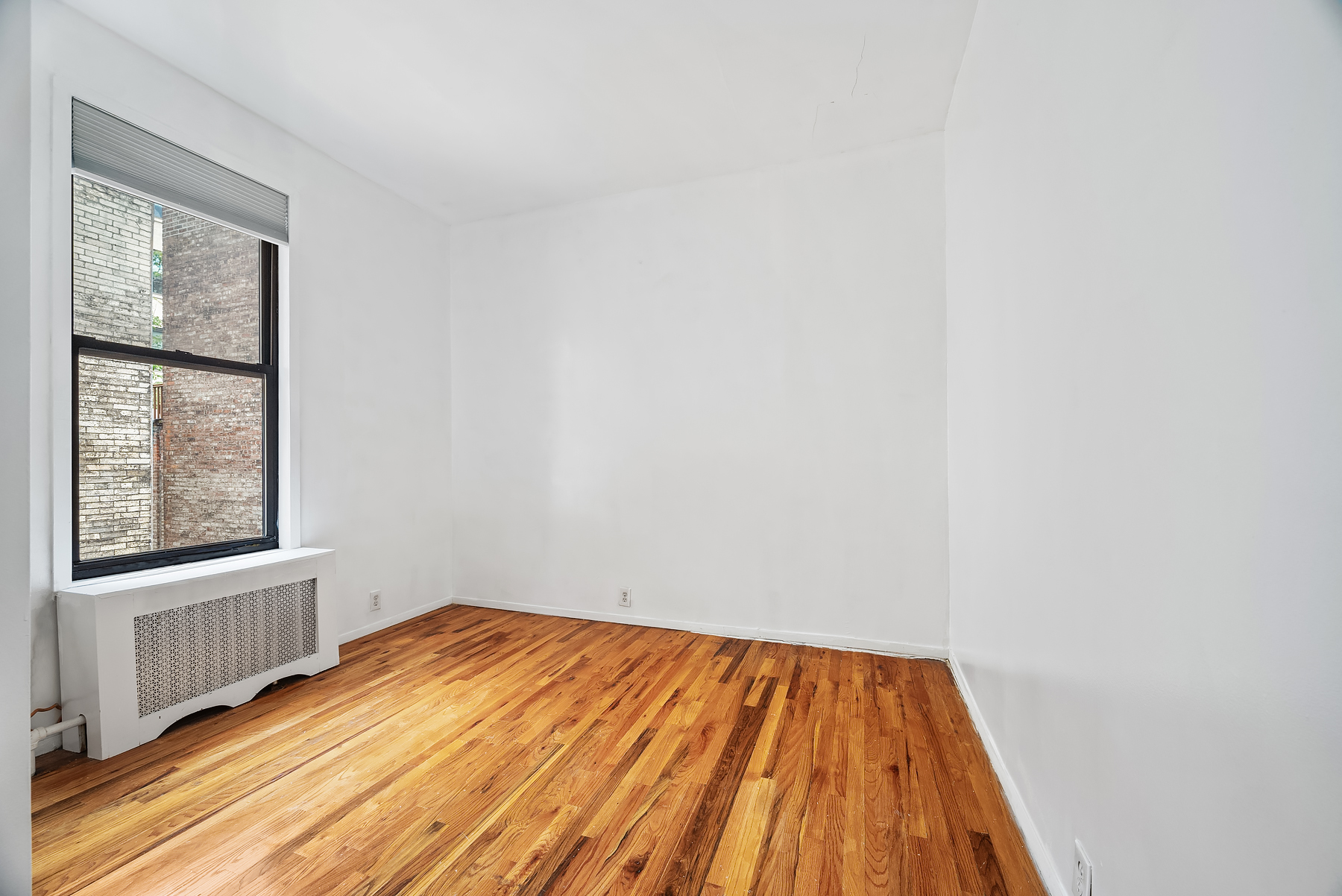 862 West End Avenue, Unit 2R Manhattan, NY 10025 - Photo 3 of 8 a view of a room with wooden floor and windows