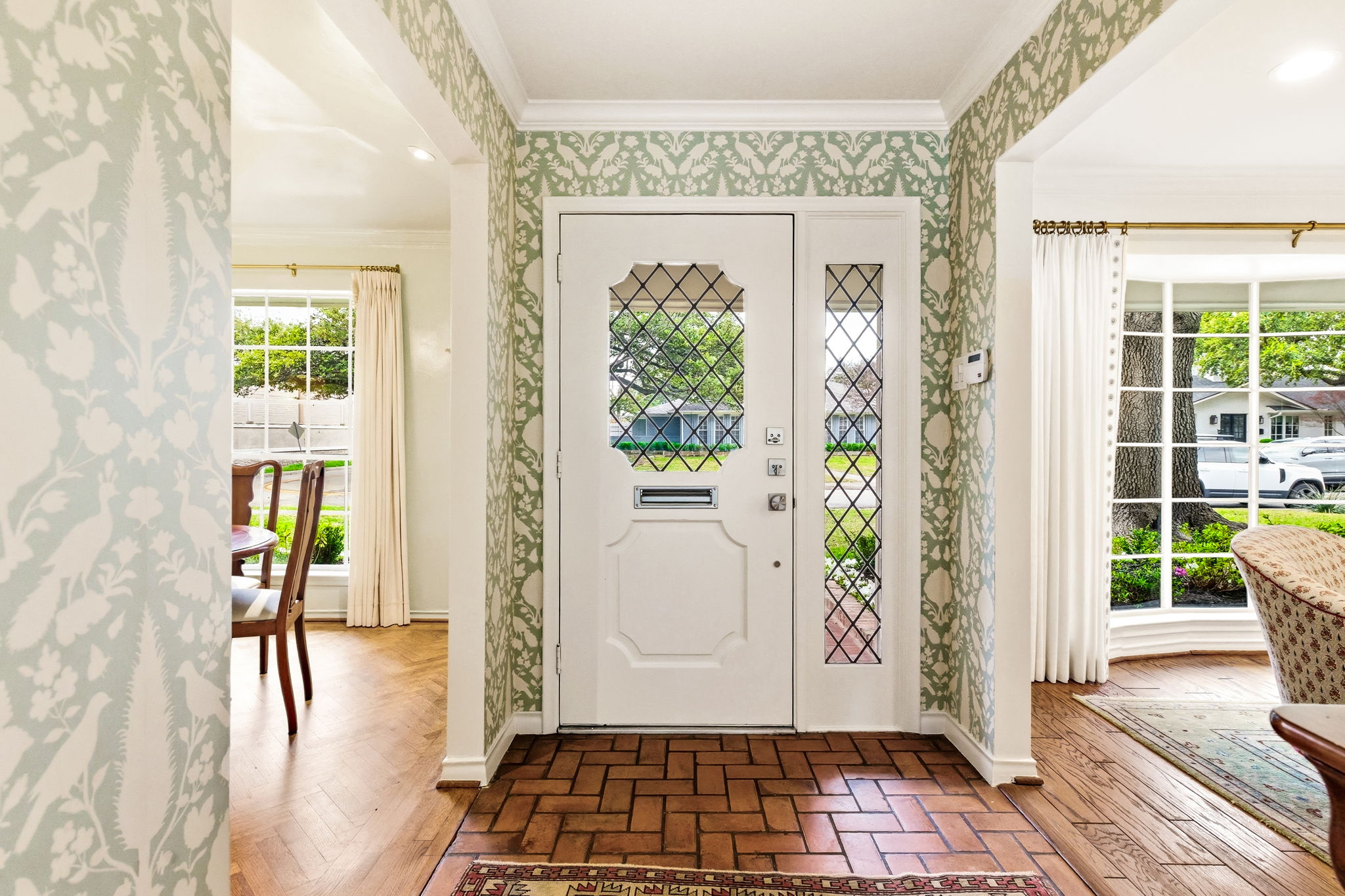 5765 Stonegate Road Dallas, TX 75209 - Photo 3 of 37 a view of entryway with wooden floor and a livingroom
