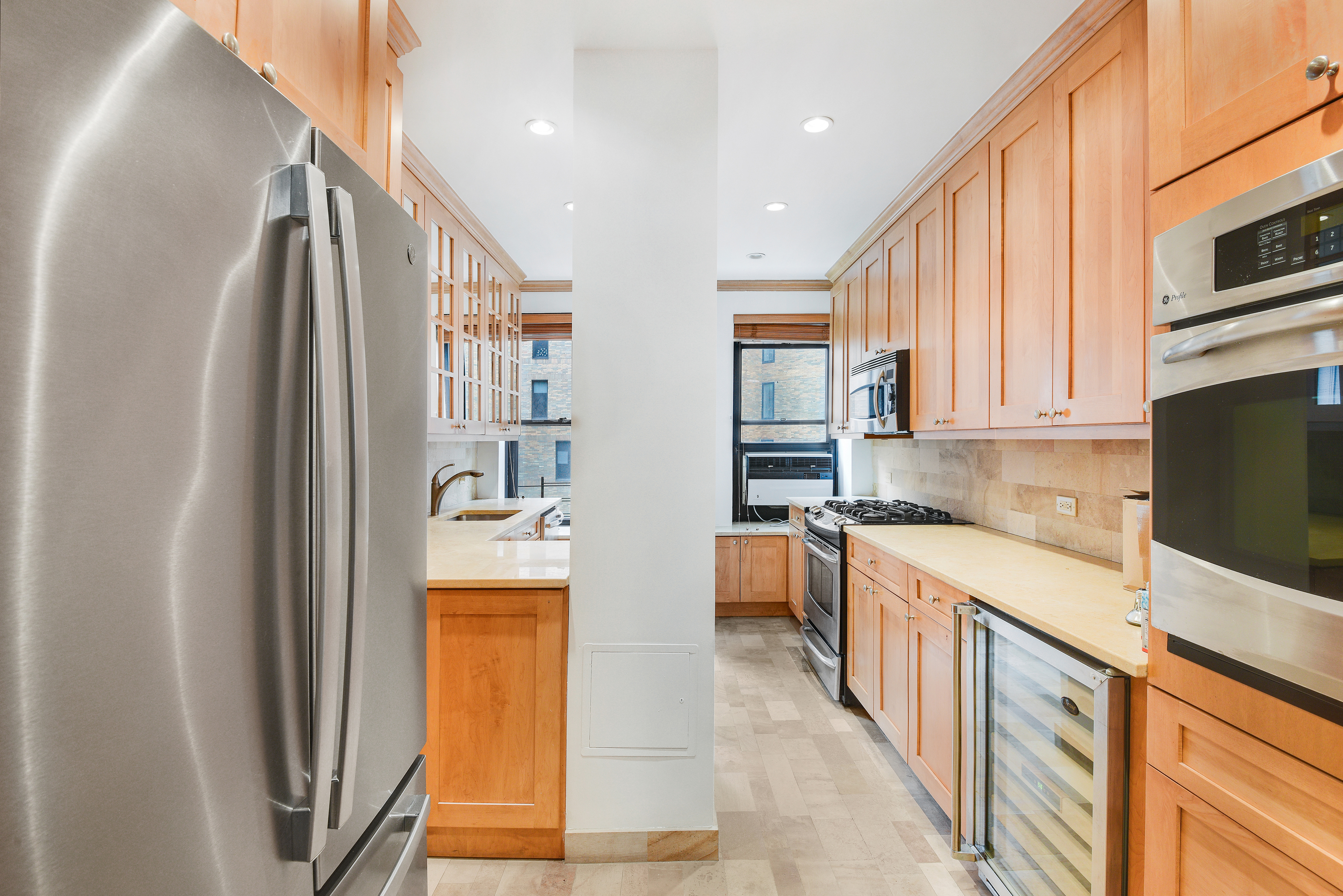 7 Park Avenue, Unit 8A9ABC Manhattan, NY 10016 - Photo 5 of 23 a kitchen with stainless steel appliances granite countertop a refrigerator a stove and a sink