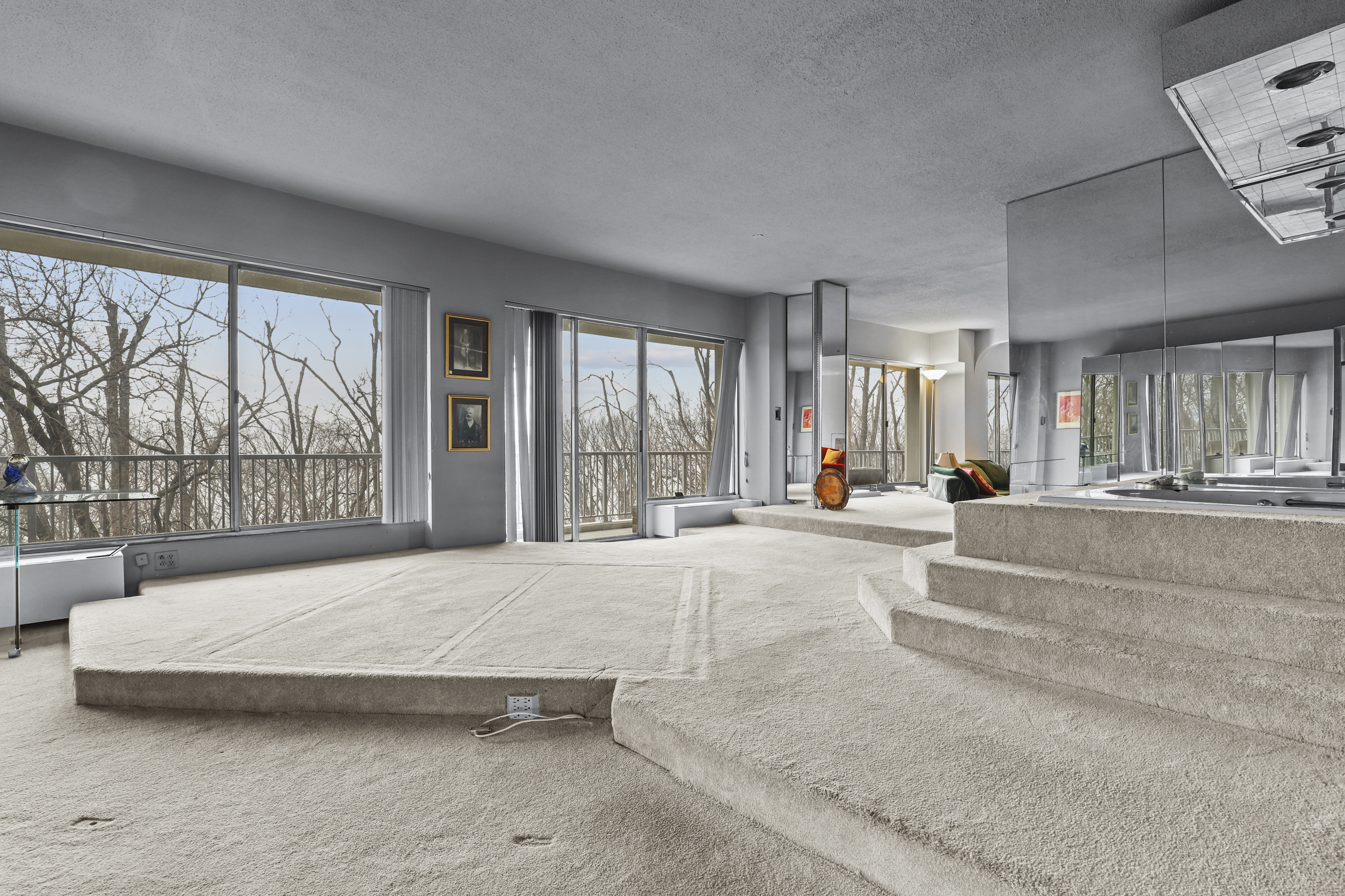 4455 Douglas Avenue, Unit 3FE Bronx, NY 10471 - Photo 19 of 53 a spacious bedroom with a large bed and a large window