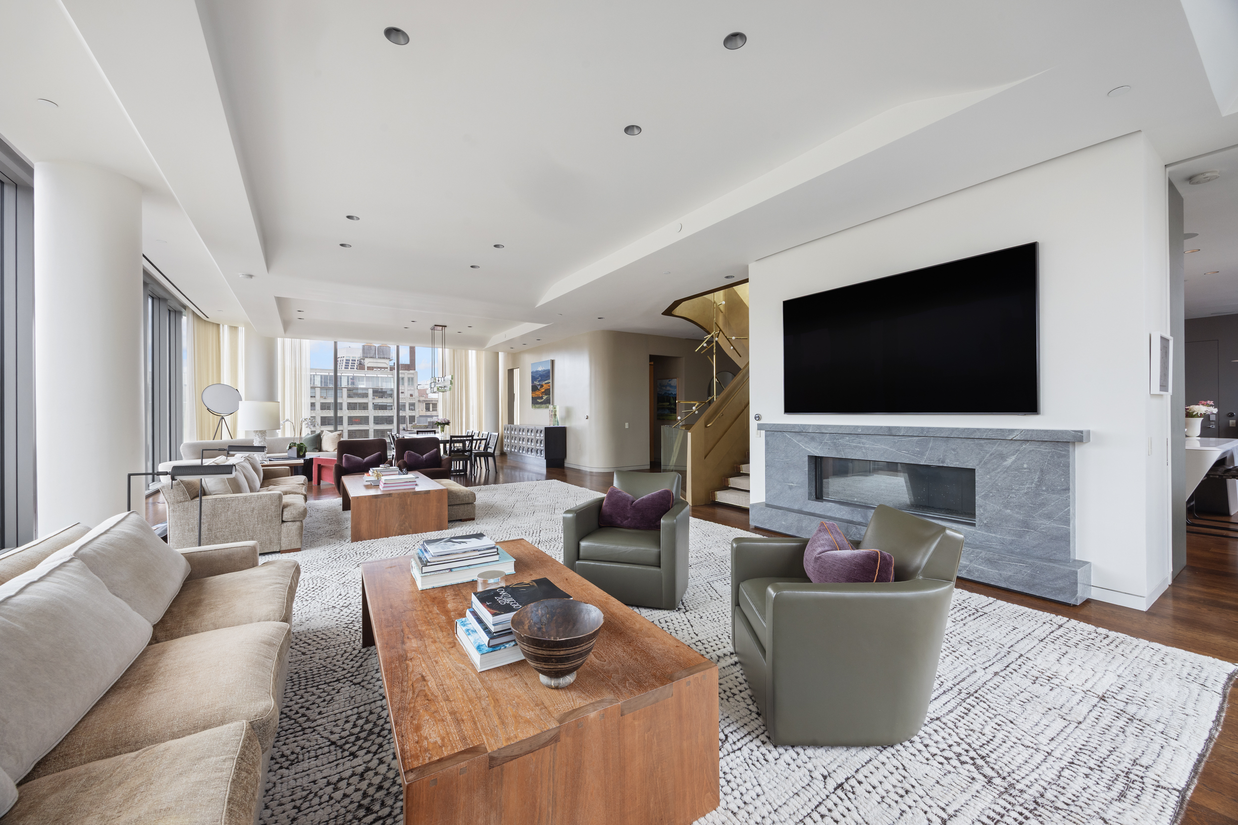 520 West 28th Street, Unit PH37 Manhattan, NY 10001 - Photo 6 of 45 a living room with fireplace furniture and a flat screen tv