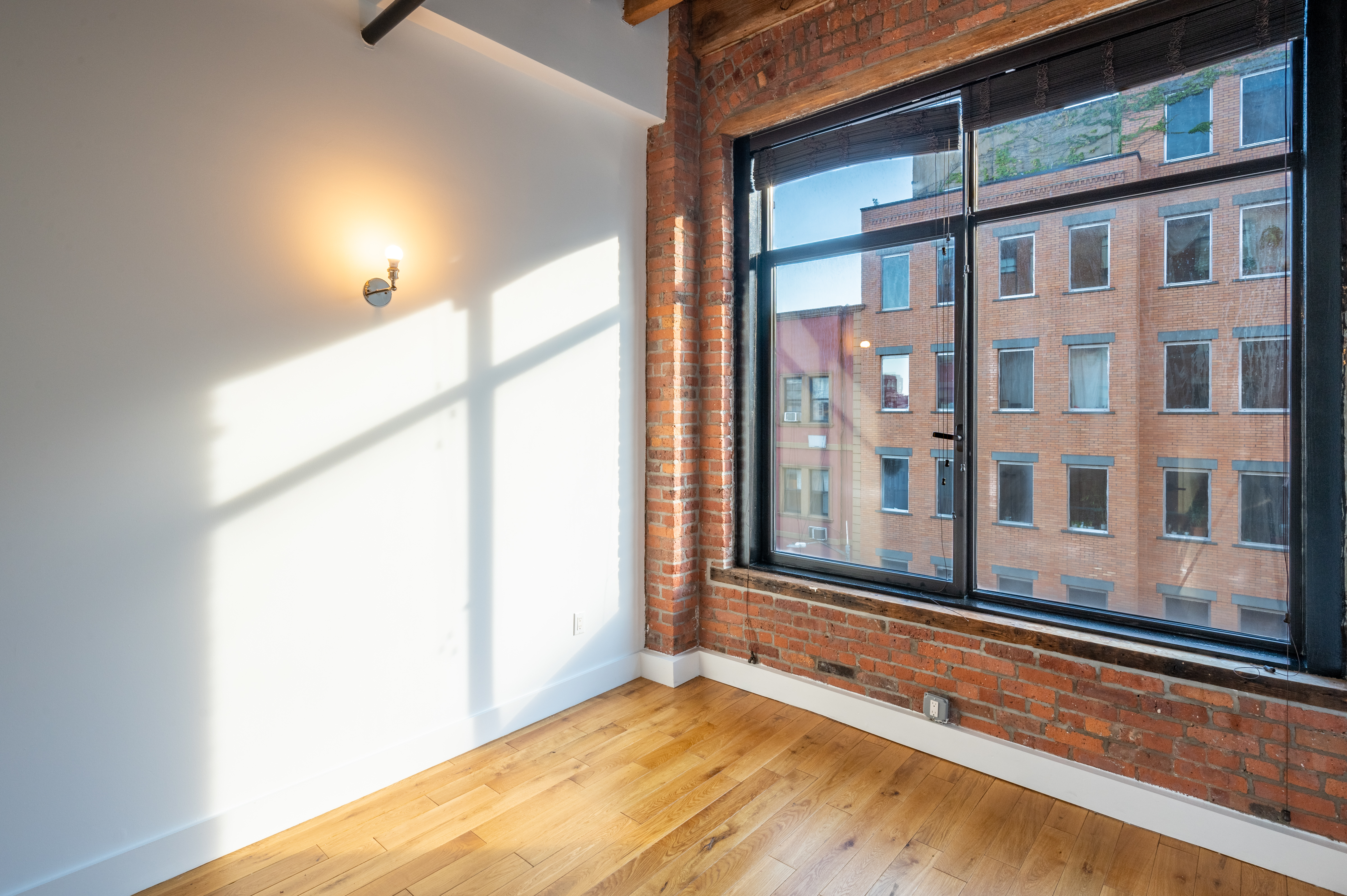 139 North 10th Street, Unit 4B Brooklyn, NY 11249 - Photo 6 of 10 a view of a building from a window