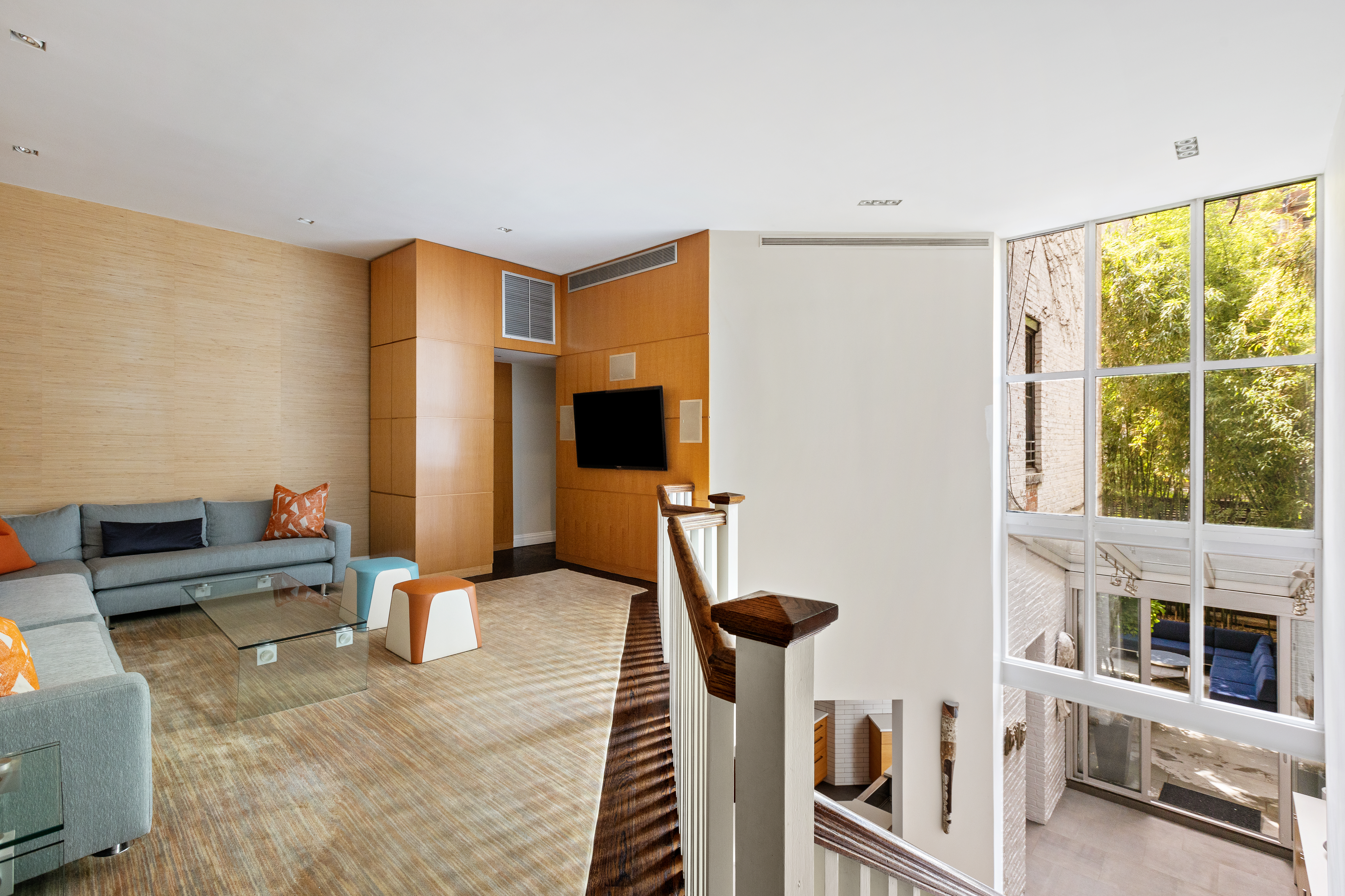 48 West 86th Street, Unit 1 Manhattan, NY 10024 - Photo 7 of 17 a very nice looking room with a large window and a flat screen tv