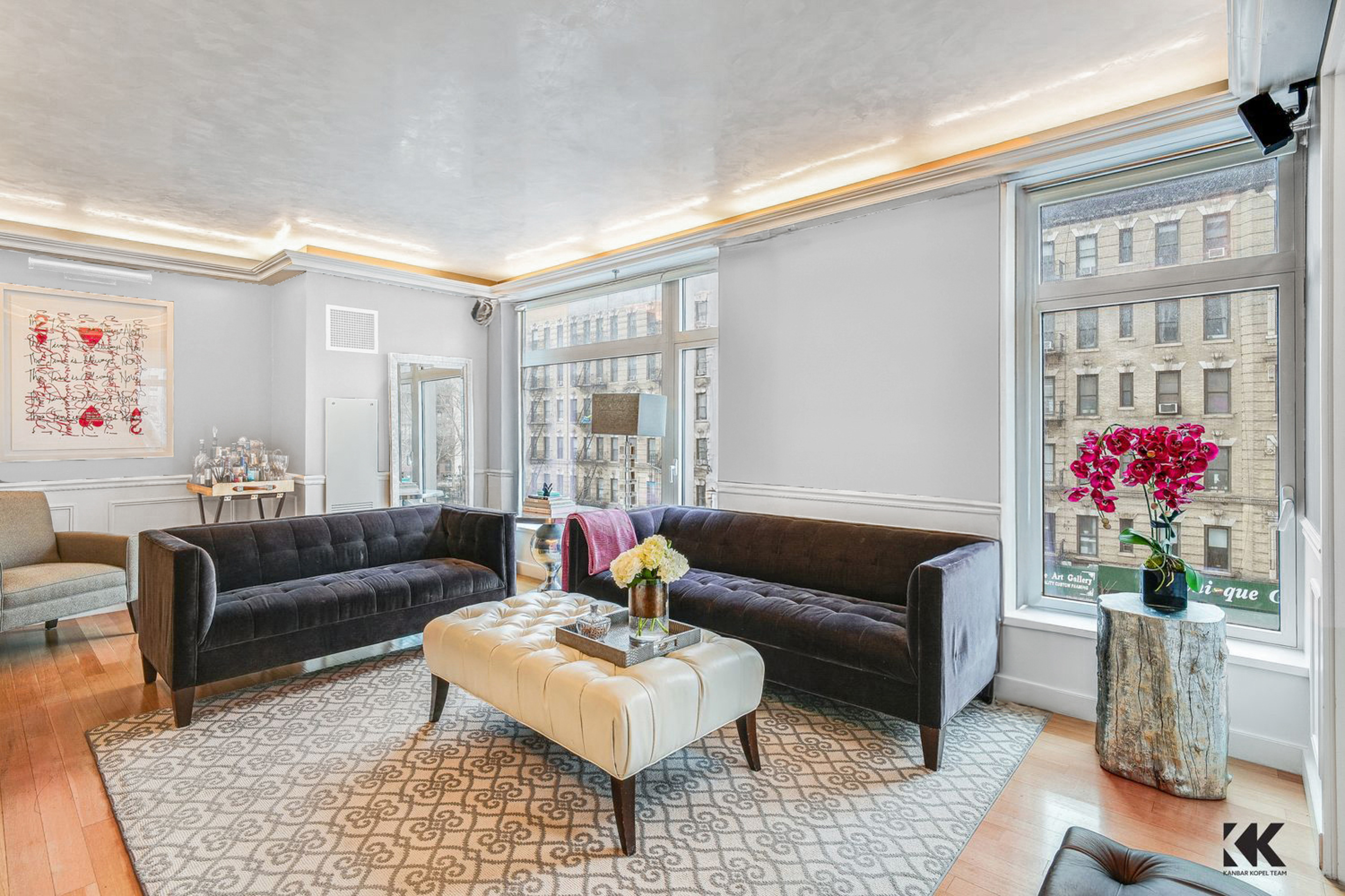 400 East 67th Street, Unit 3CD Manhattan, NY 10065 - Photo 2 of 28 a living room with furniture and a potted plant