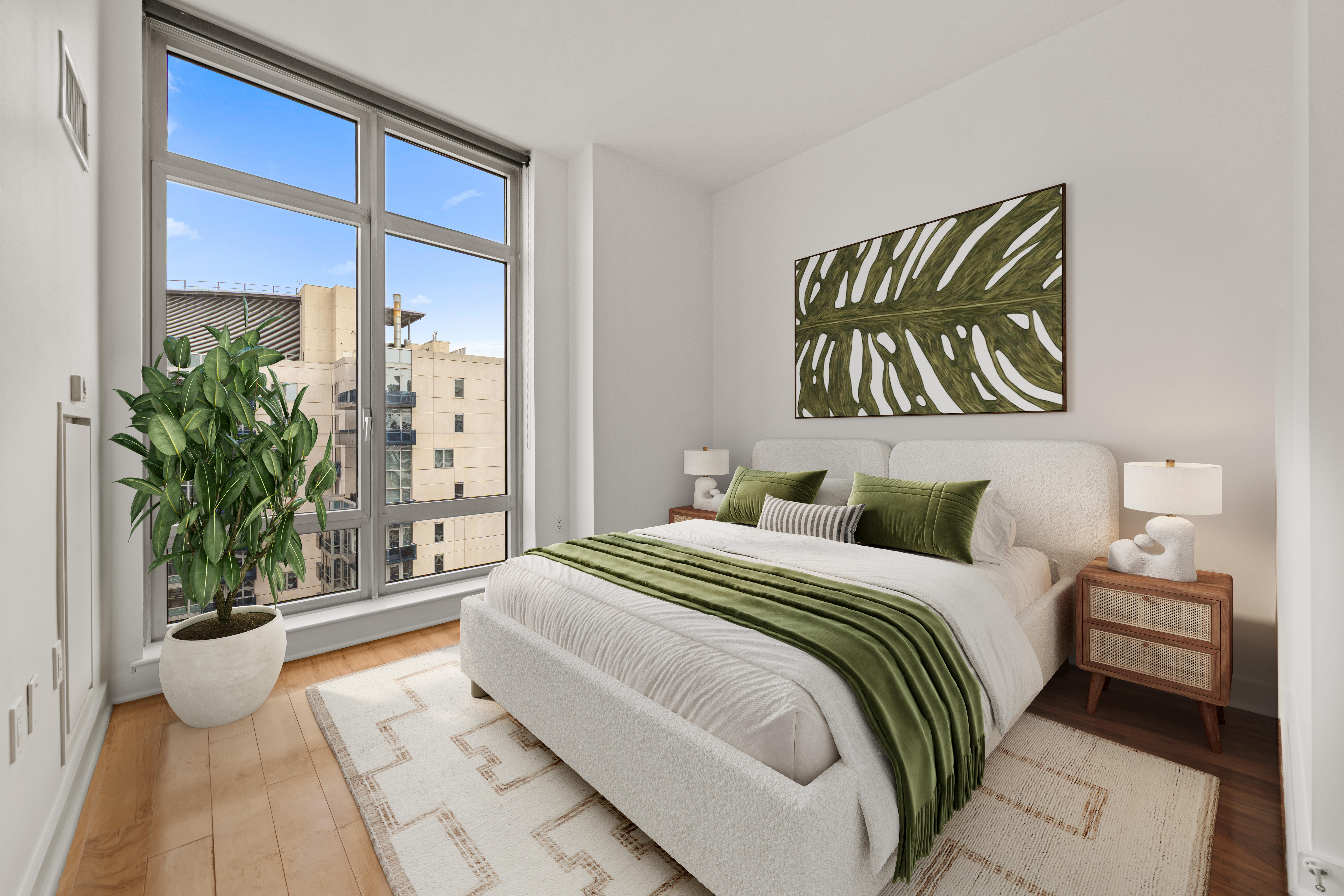2 Northside Piers, Unit 30Y Brooklyn, NY 11249 - Photo 6 of 22 a bedroom with a large bed and a potted plant