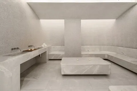 a bathroom with a double vanity sink mirror and bathtub