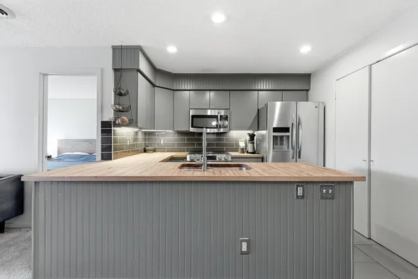 a living room with couch and a large window