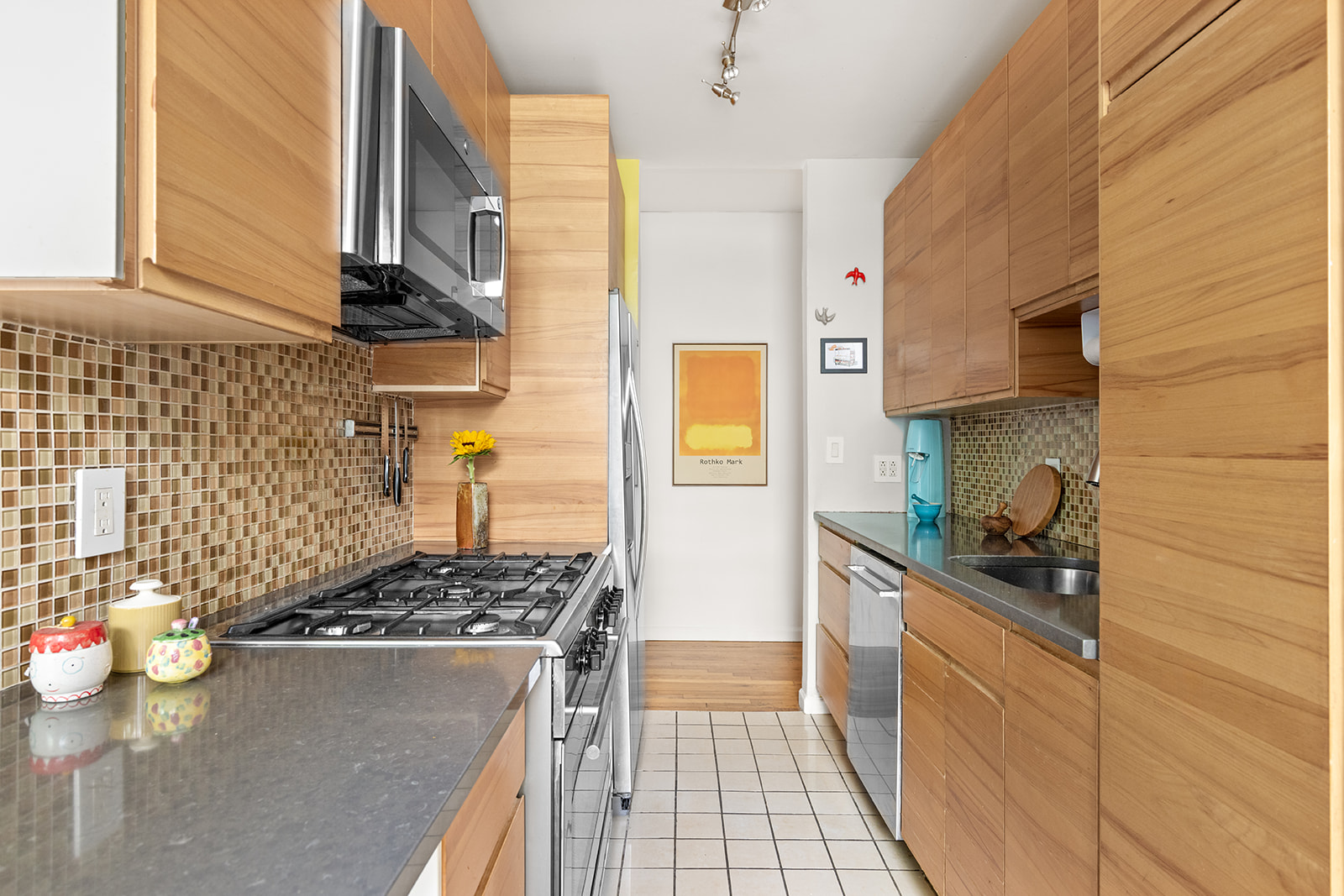 295 St Johns Place, Unit 1C Brooklyn, NY 11238 - Photo 6 of 17 a kitchen with a sink a stove and cabinets