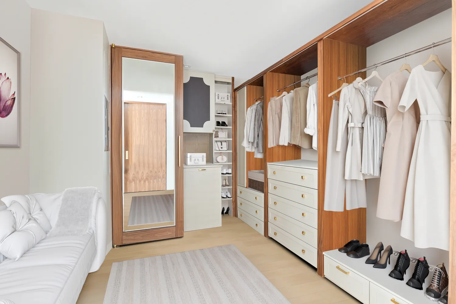 a view of walk in closet with clothes and shoes