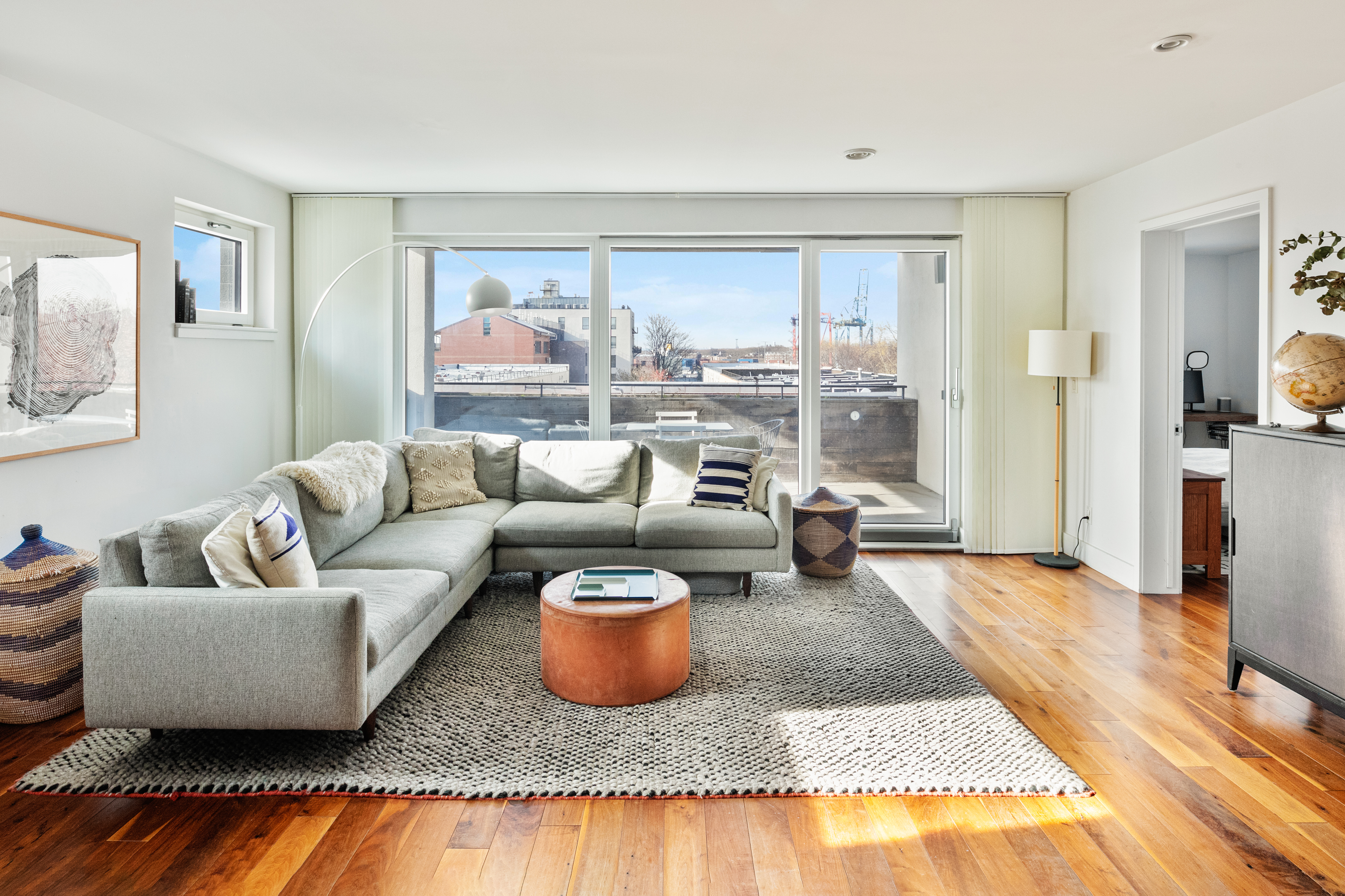 a living room with furniture and a rug