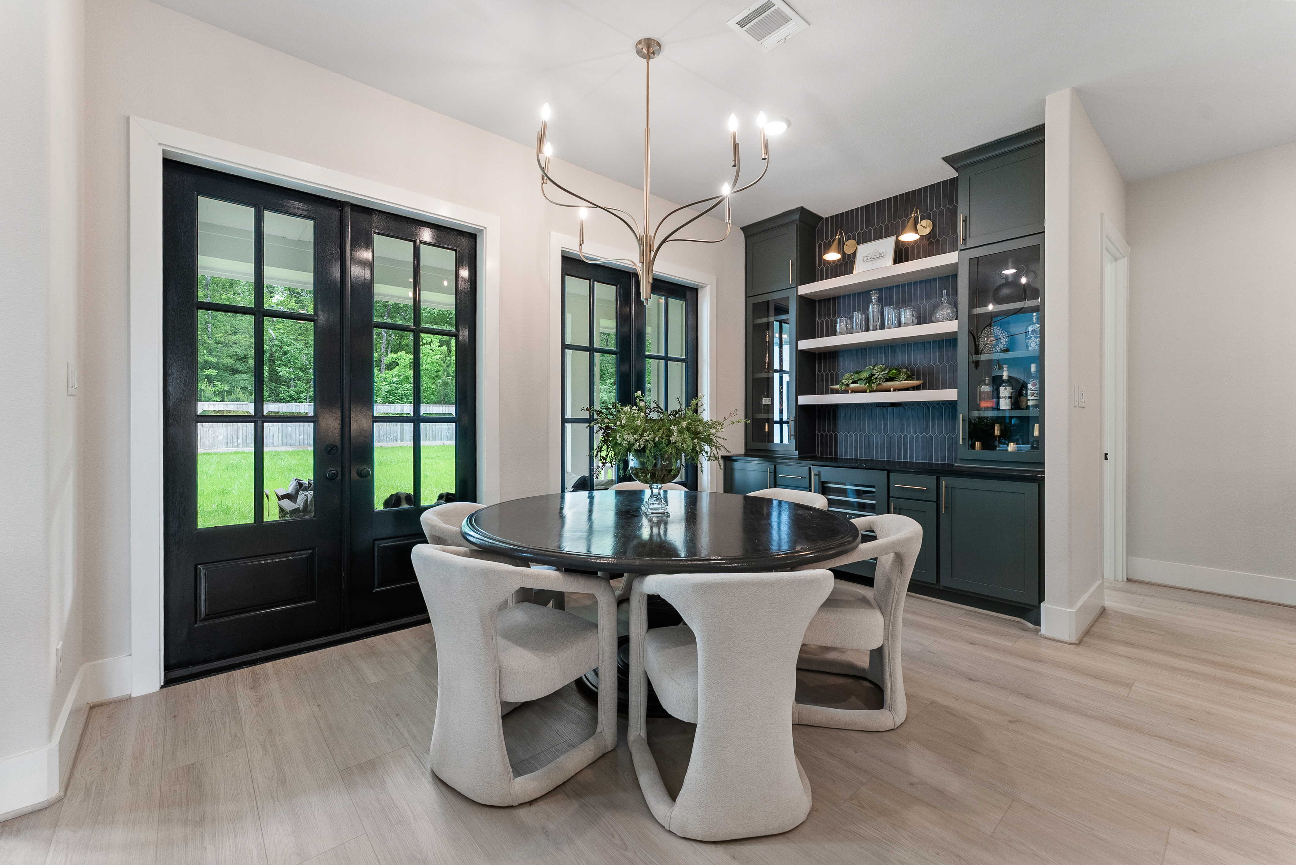 2118 Bennet Court Conroe, TX 77384 - Photo 22 of 70 a dining room with furniture a window and wooden floor