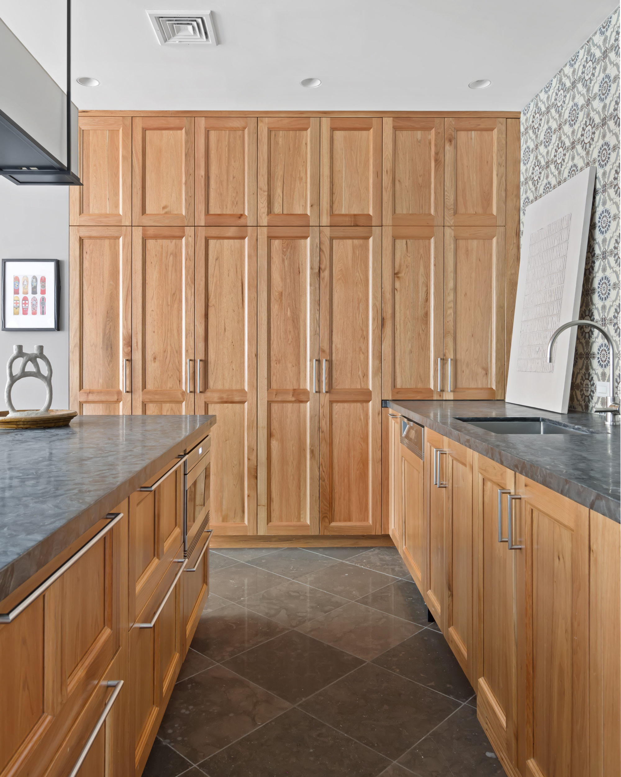 95 Charles Street, Unit TH Manhattan, NY 10014 - Photo 26 of 29 a view of a kitchen with granite countertop a sink and a wooden floor
