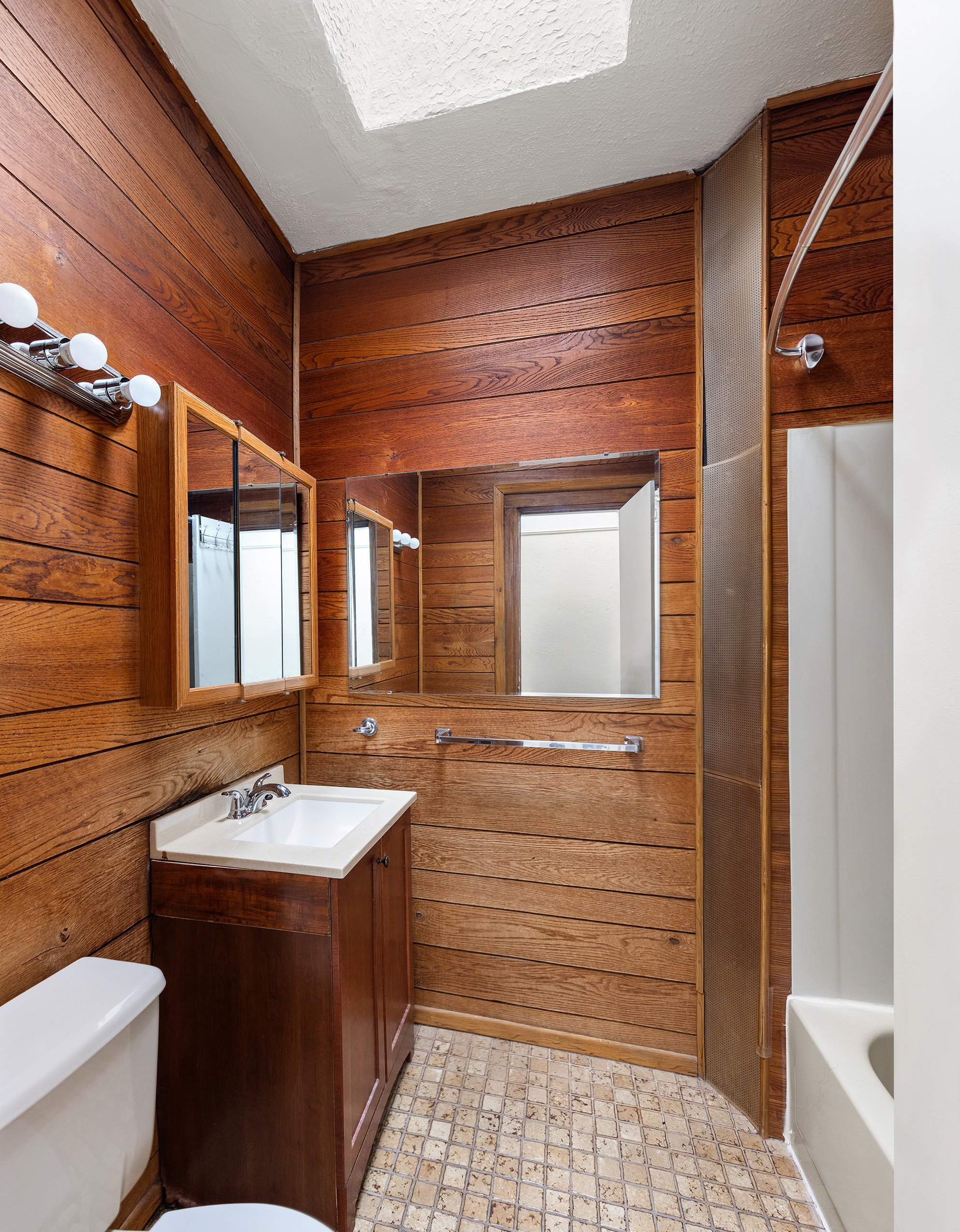 31-22 36th Street Queens, NY 11106 - Photo 5 of 10 a bathroom with a sink and a mirror
