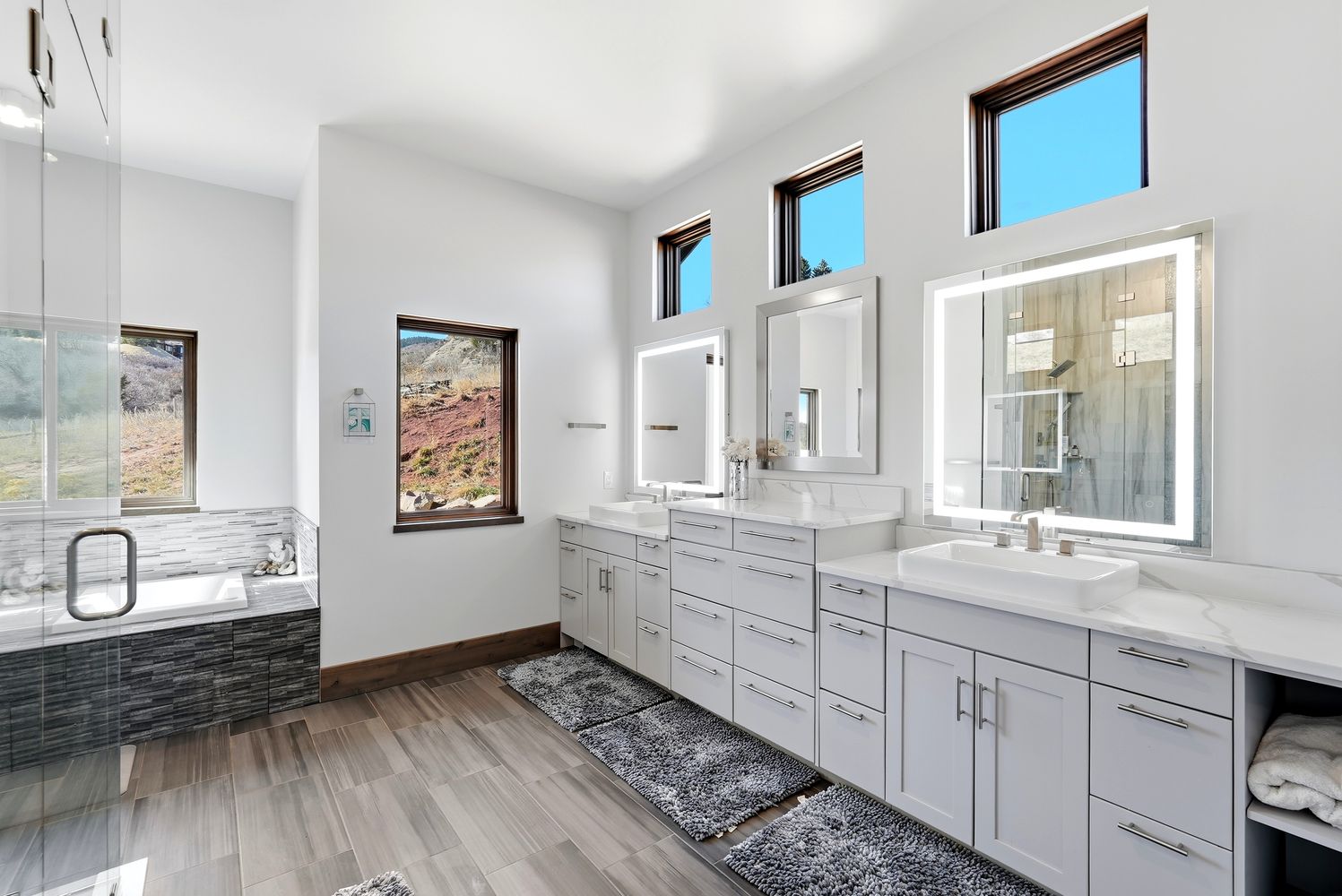a living room with furniture and stairs