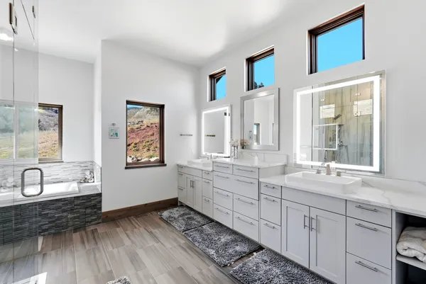 a living room with furniture and stairs