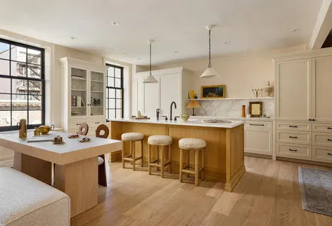 a kitchen with stainless steel appliances granite countertop a sink stove and wooden floor