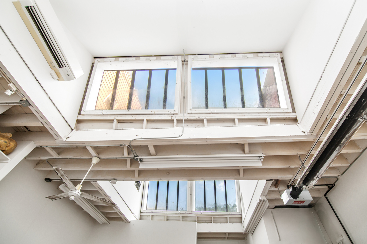5-38 47th Road Queens, NY 11101 - Photo 6 of 14 a view of a porch with wooden floor