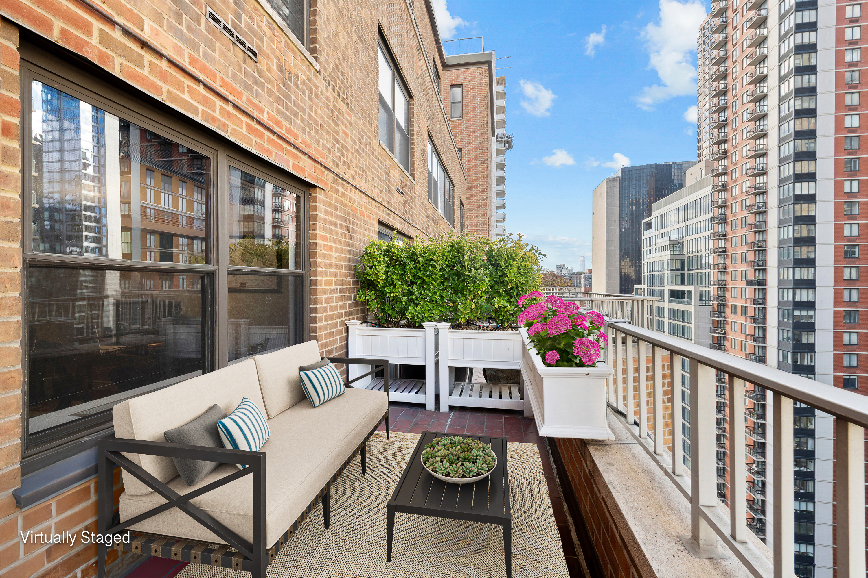 305 East 40th Street, Unit 19CD Manhattan, NY 10016 - Photo 6 of 16 a view of two chairs and table in the balcony