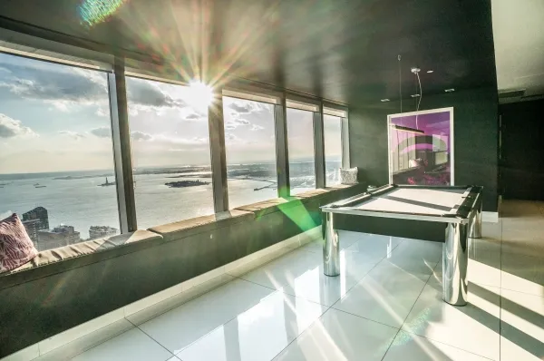 a view of a living room and floor to ceiling window