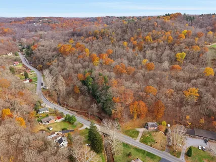 an aerial view of residential house and green space