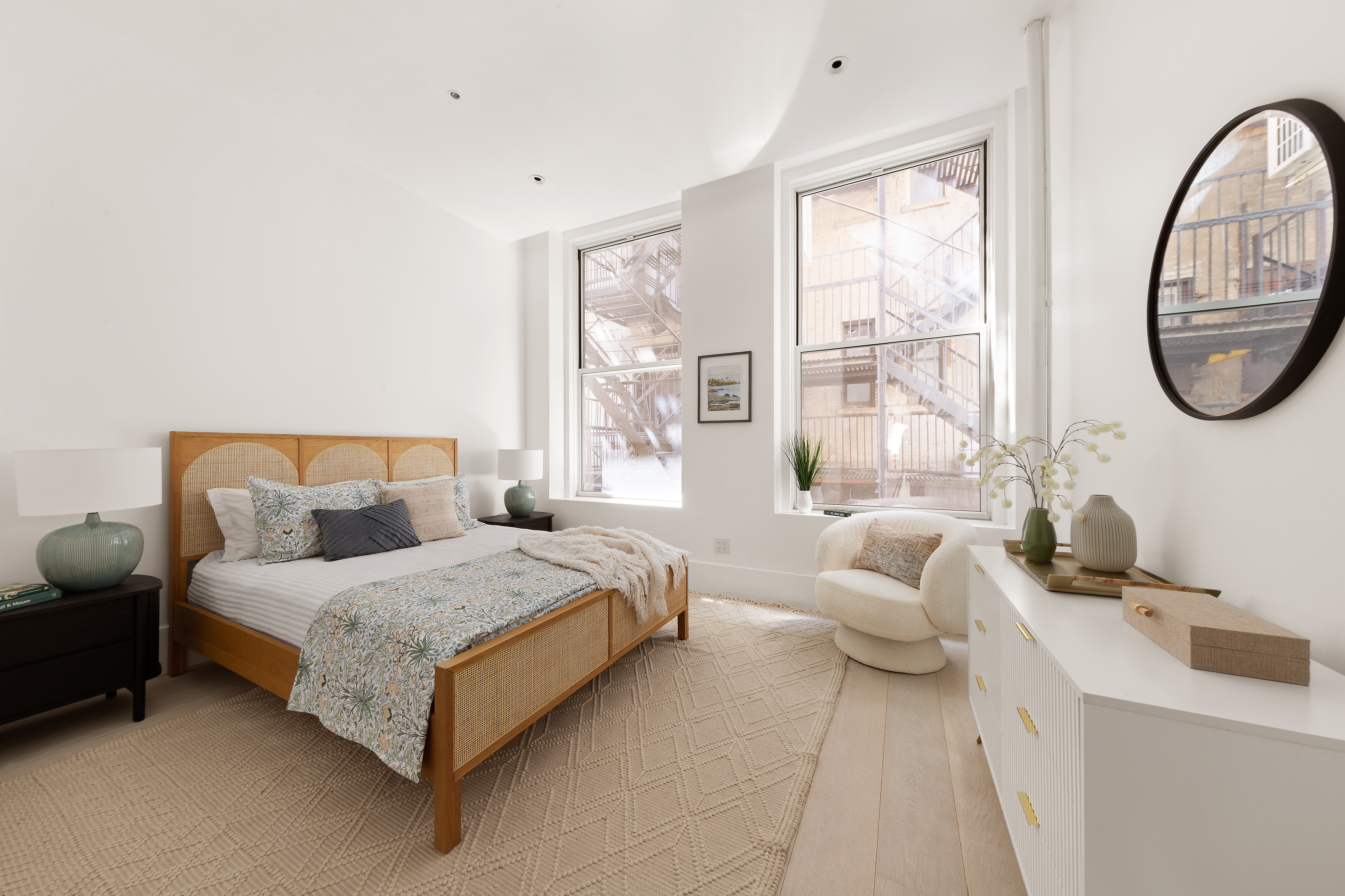 48 West 22nd Street, Unit 2 Manhattan, NY 10010 - Photo 7 of 11 a bedroom with a bed a couch and a window