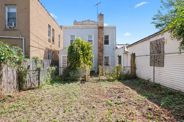 a view of a back yard of the house