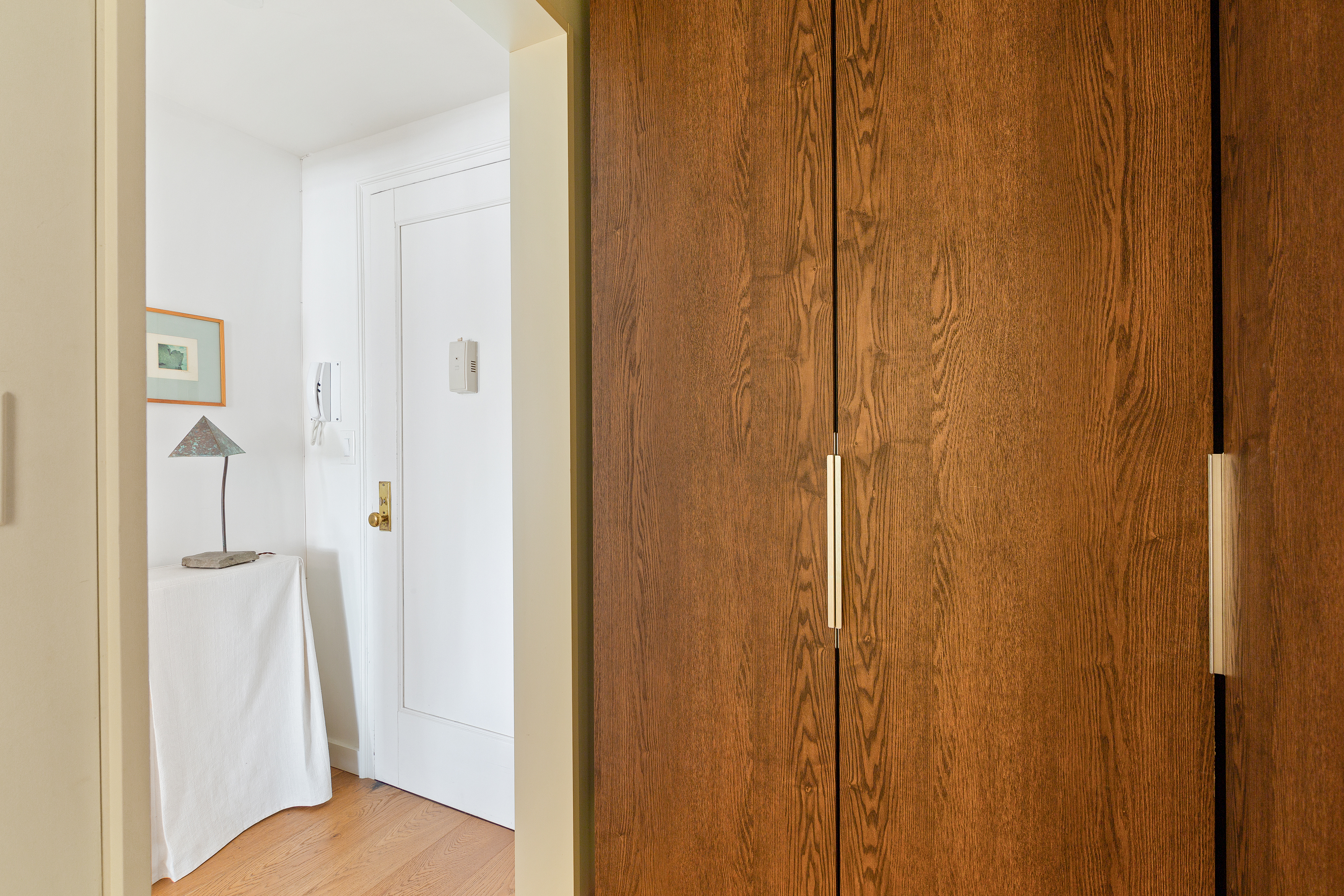 161 West 16th Street, Unit 12D Manhattan, NY 10011 - Photo 7 of 8 a view of a bedroom from the hallway