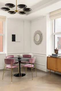 a reading room with furniture and a window