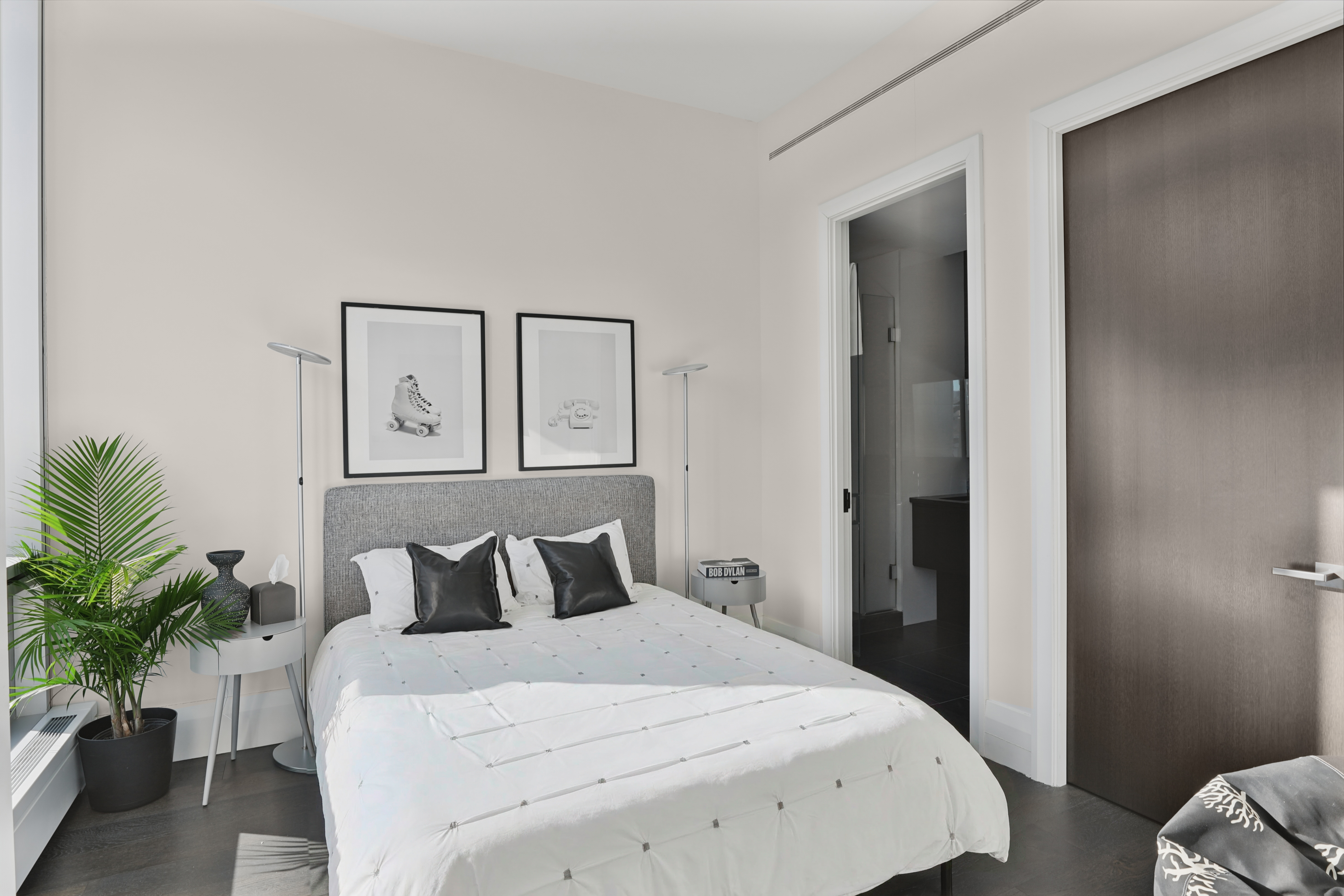 172 Madison Avenue, Unit 24B Manhattan, NY 10016 - Photo 11 of 16 a bedroom with a bed and a potted plant