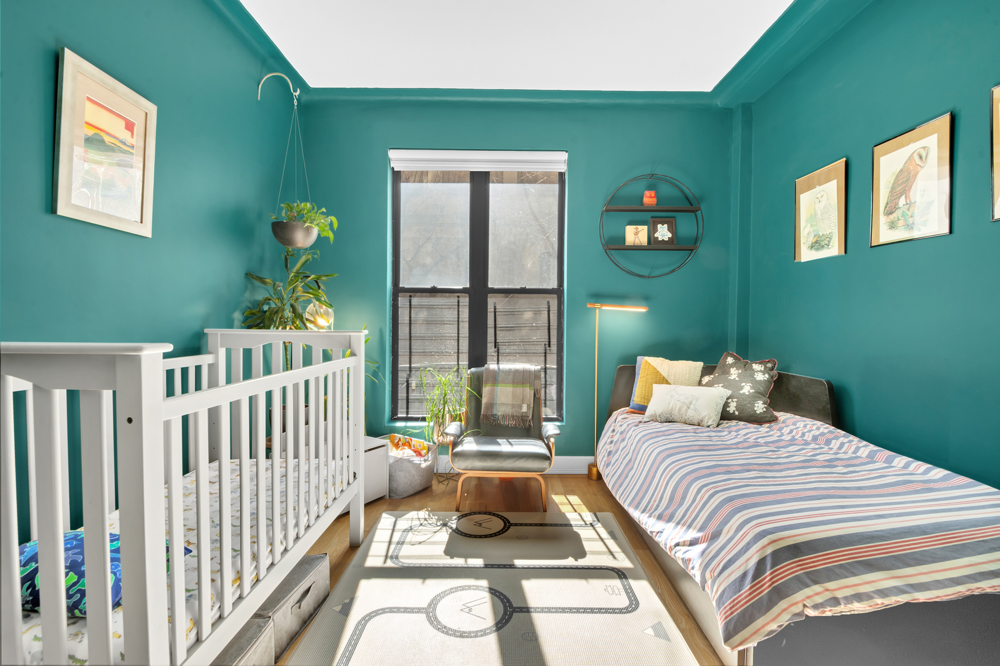 790 Riverside Drive, Unit 2LX Manhattan, NY 10032 - Photo 9 of 10 a bedroom with a bed and a large window