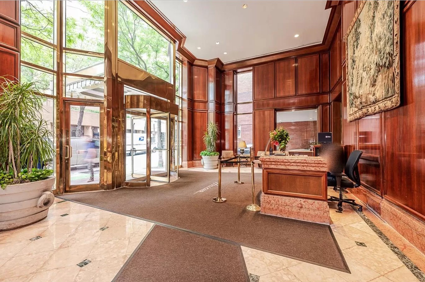 415 East 37th Street, Unit 32G Manhattan, NY 10016 - Photo 8 of 19 a living room filled with furniture and a large window