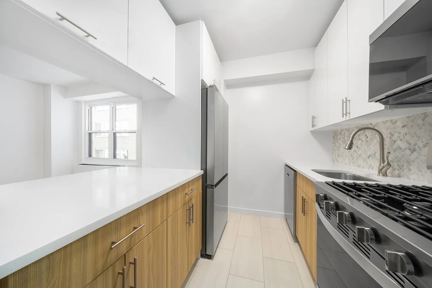 a kitchen with a stove and a sink