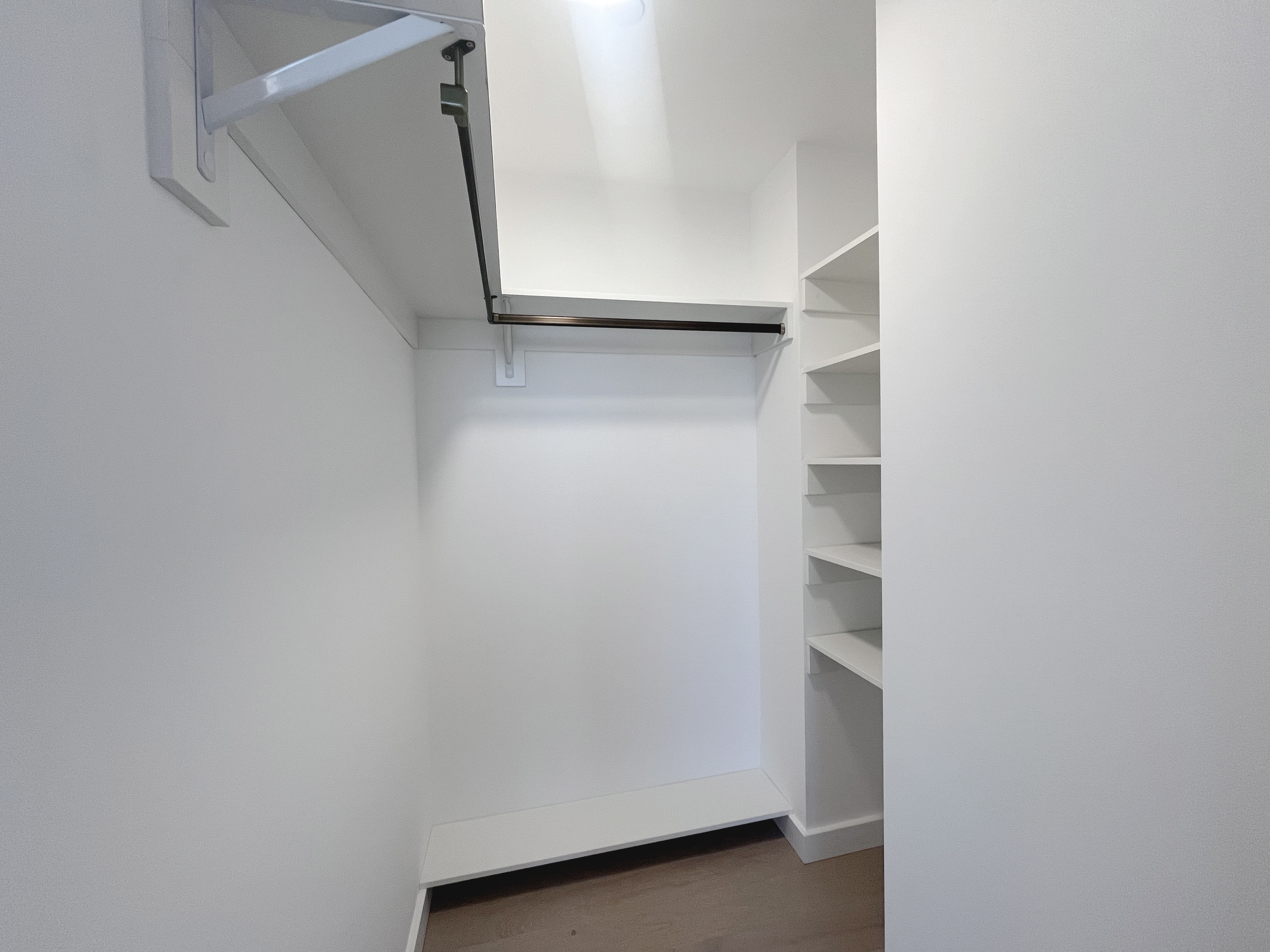 45-3 Court Square, Unit 5906 Queens, NY 11101 - Photo 5 of 12 a view of an empty walk in closet