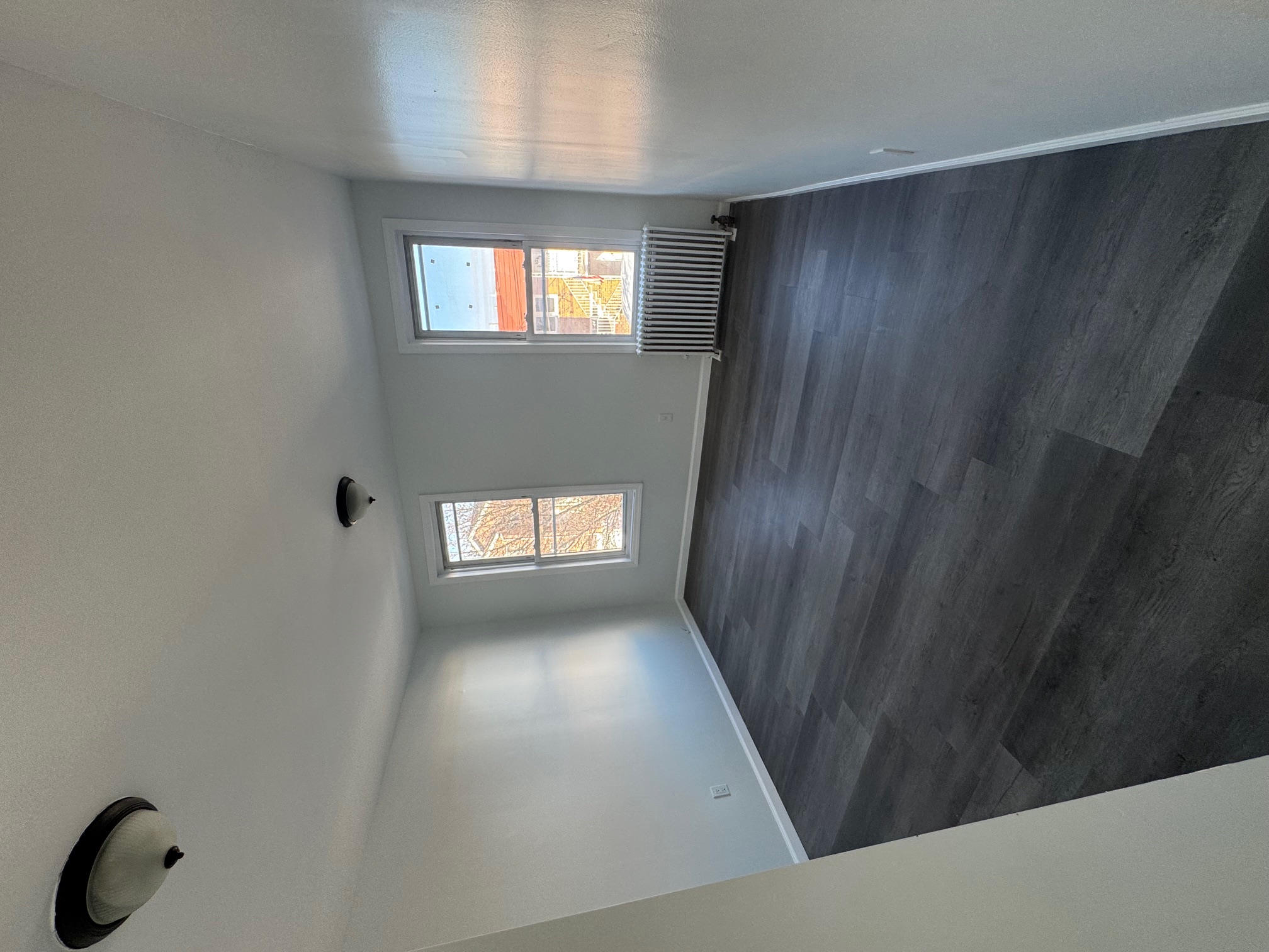 89-16 102nd Road, Unit 2 Queens, NY 11416 - Photo 8 of 13 a view of an empty room and window