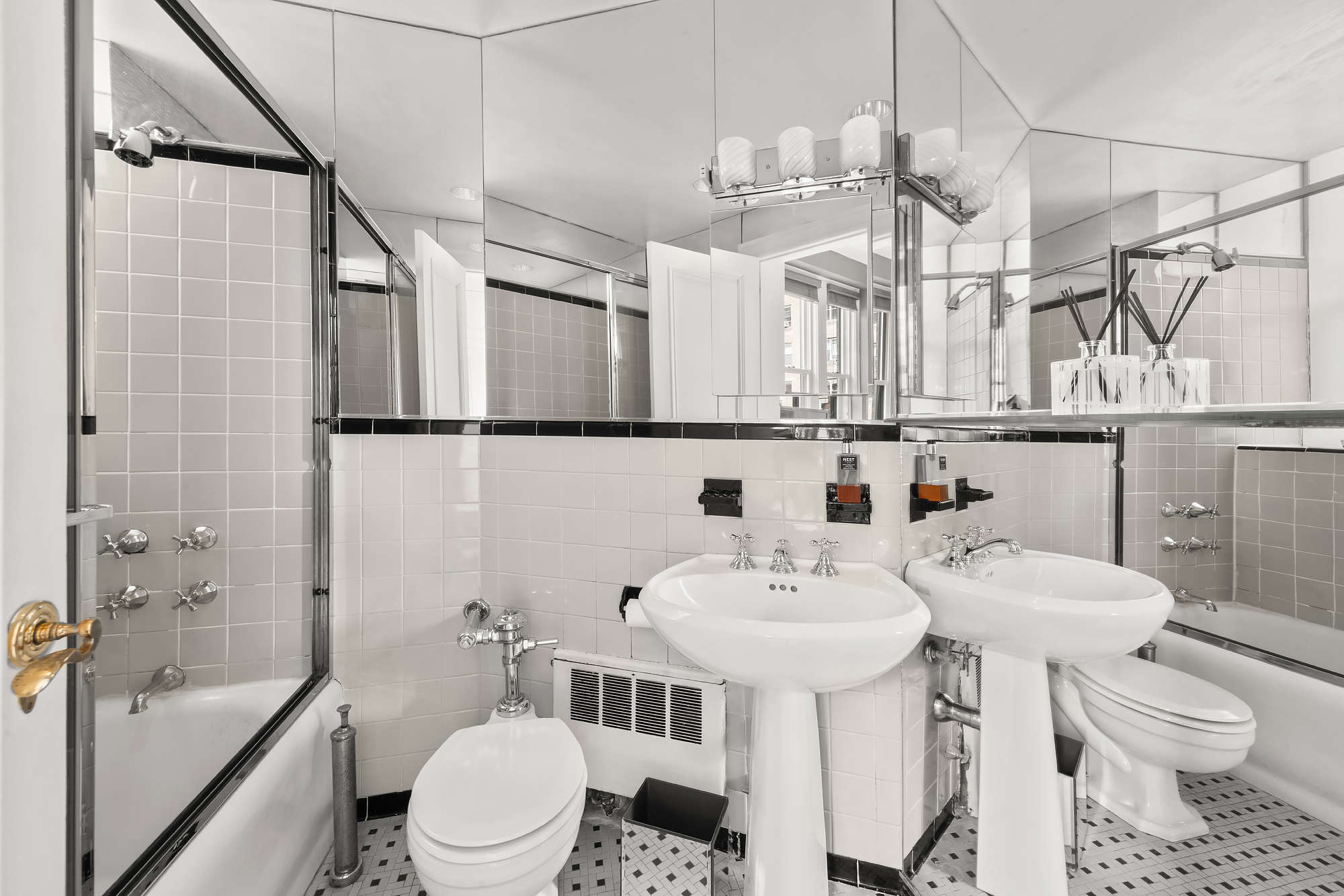 31 East 72nd Street, Unit 7B Manhattan, NY 10021 - Photo 9 of 13 a bathroom with a sink toilet and shower