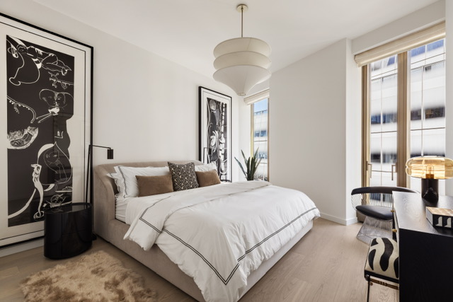 500 West 18th Street, Unit WEST 5E Manhattan, NY 10011 - Photo 10 of 15 a bedroom with double bed and a window