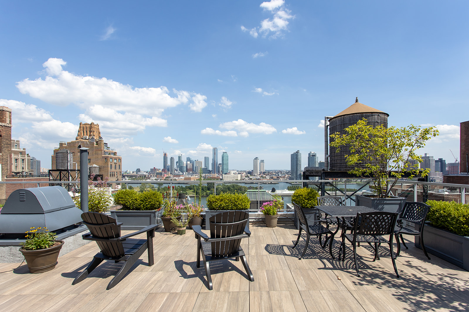 420 East 51st Street, Unit 10H Manhattan, NY 10022 - Photo 7 of 14 a view of a terrace with furniture and a potted plant