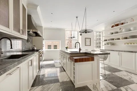 a kitchen with stainless steel appliances granite countertop a stove and a sink
