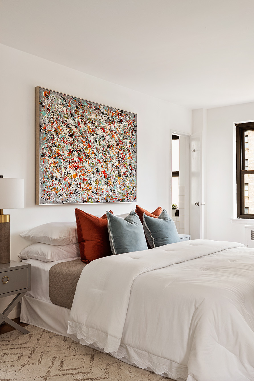 185 West End Avenue, Unit 16D Manhattan, NY 10023 - Photo 6 of 11 a bedroom with a large bed and a couch