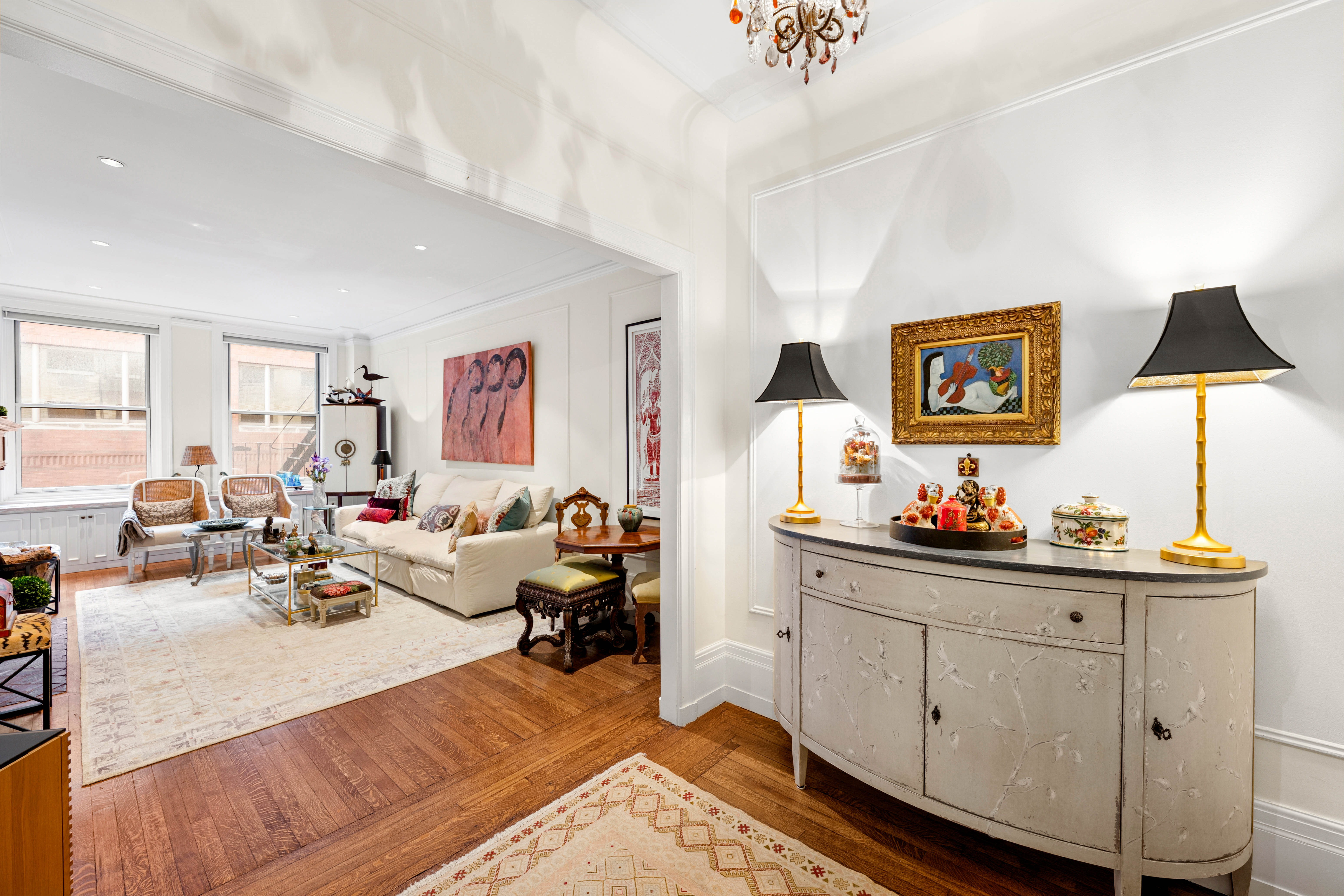 50 West 67th Street, Unit 4F Manhattan, NY 10023 - Photo 1 of 10 a living room with furniture and a flat screen tv