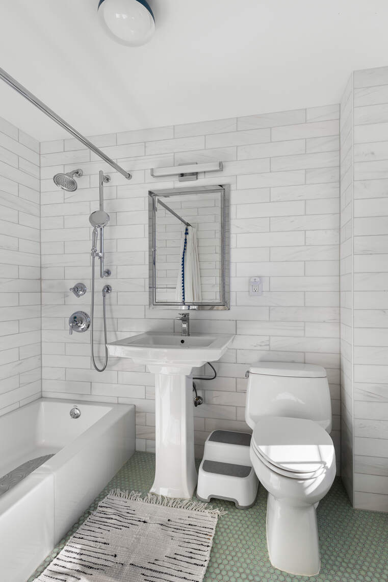 47 Plaza Street West, Unit 5B Brooklyn, NY 11217 - Photo 11 of 14 a bathroom with a toilet a sink and bathtub