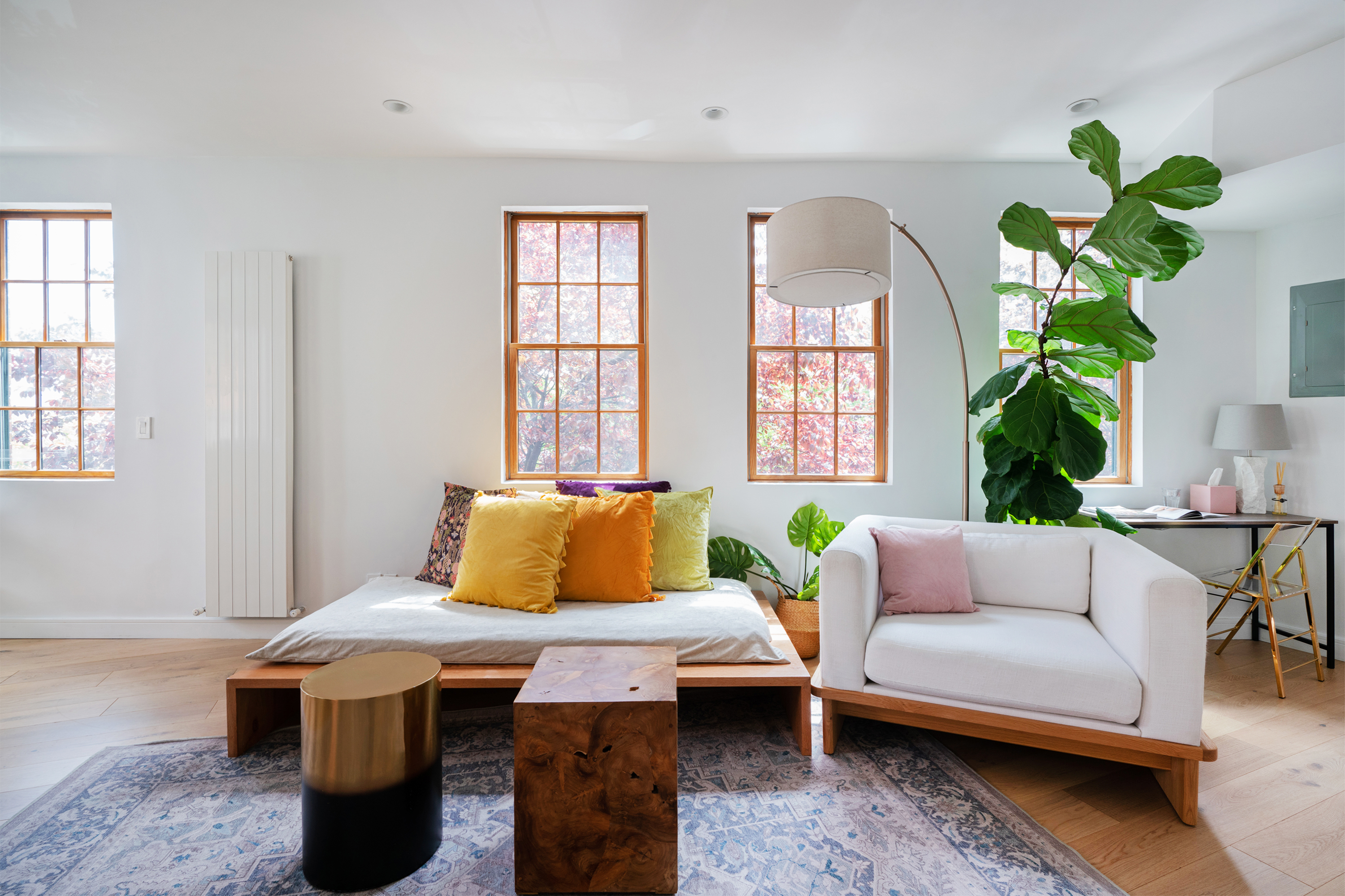 334 Plymouth Street Brooklyn, NY 11201 - Photo 8 of 32 a living room with furniture a chandelier and a window
