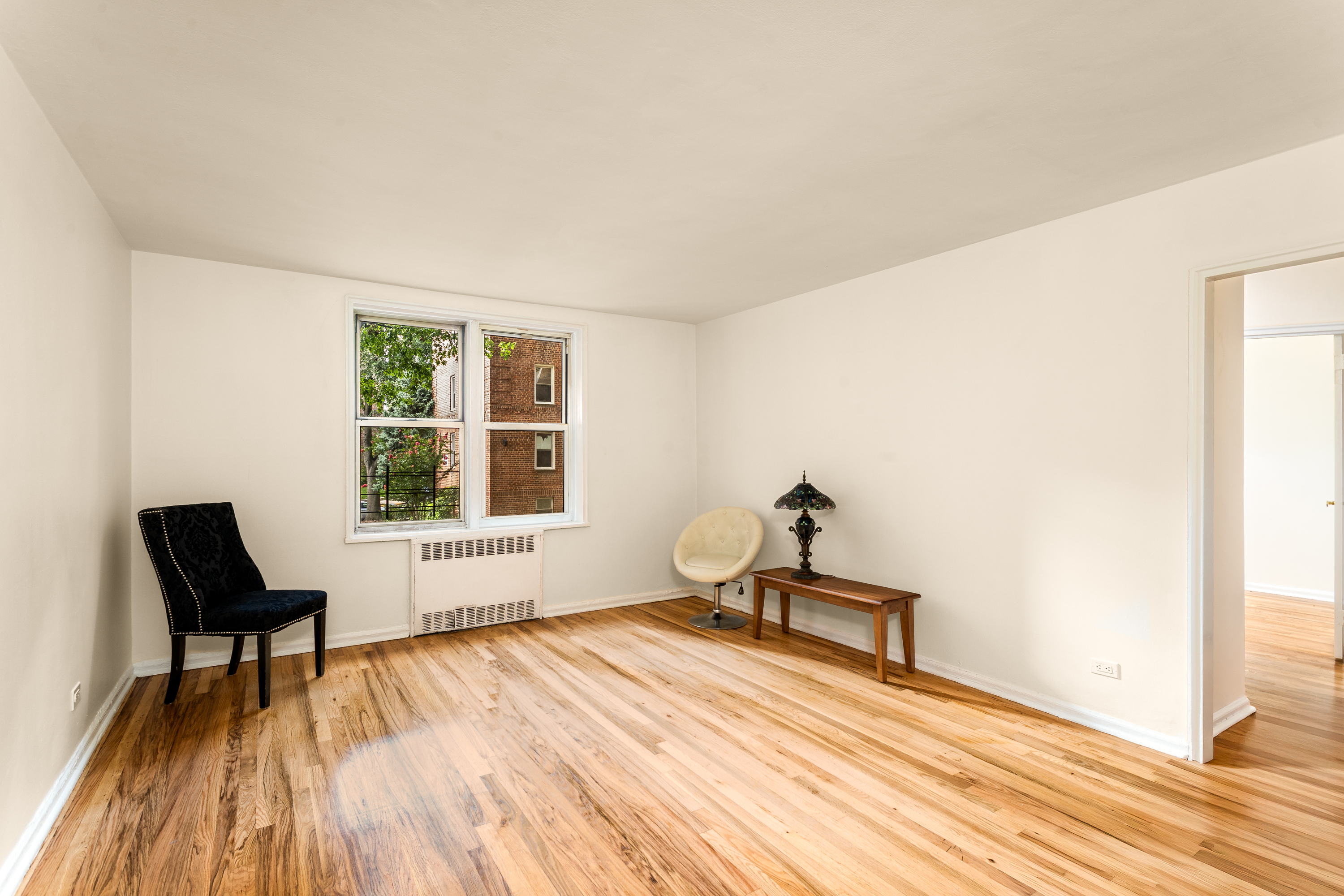 5610 Netherland Avenue, Unit 1G Bronx, NY 10471 - Photo 2 of 14 a living room with furniture and a window