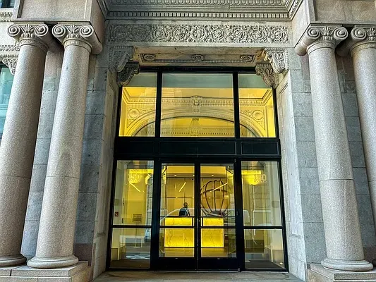 a view of walk in closet with potted plant next to a window