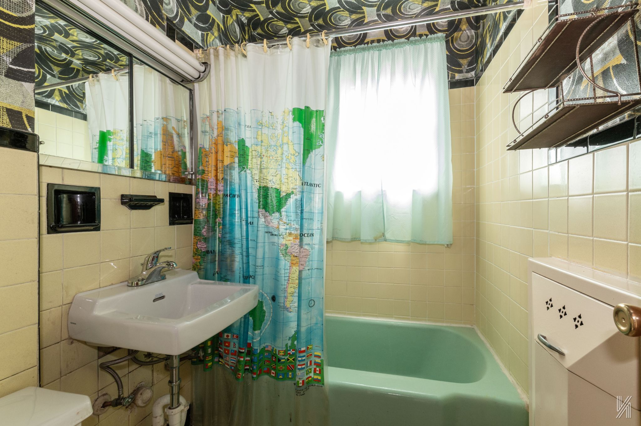 135-16 95th Street Queens, NY 11417 - Photo 15 of 21 a bathroom with a sink a bathtub and a shower