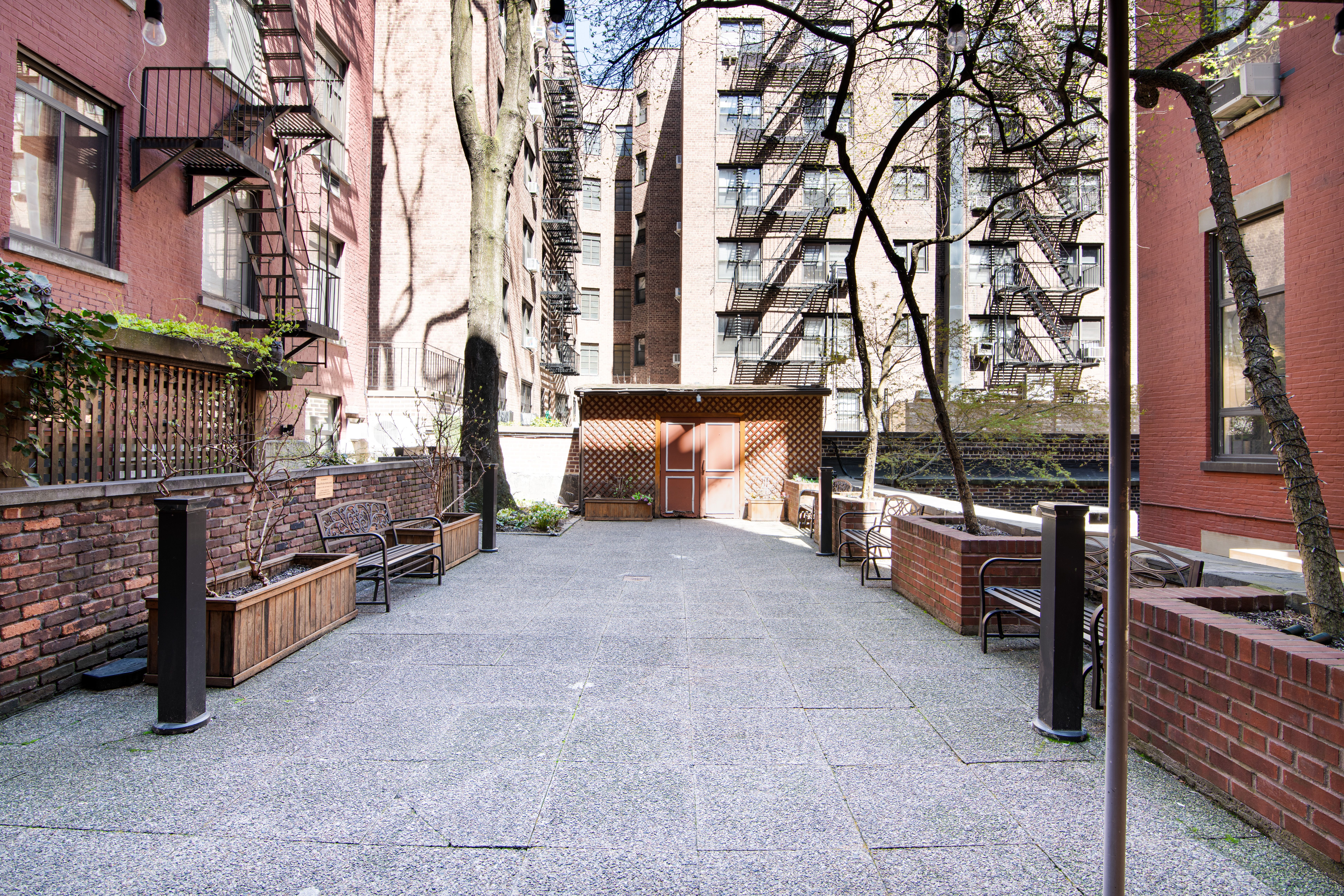 303 Mercer Street, Unit A601 Manhattan, NY 10003 - Photo 17 of 19 a view of a backyard with sitting area