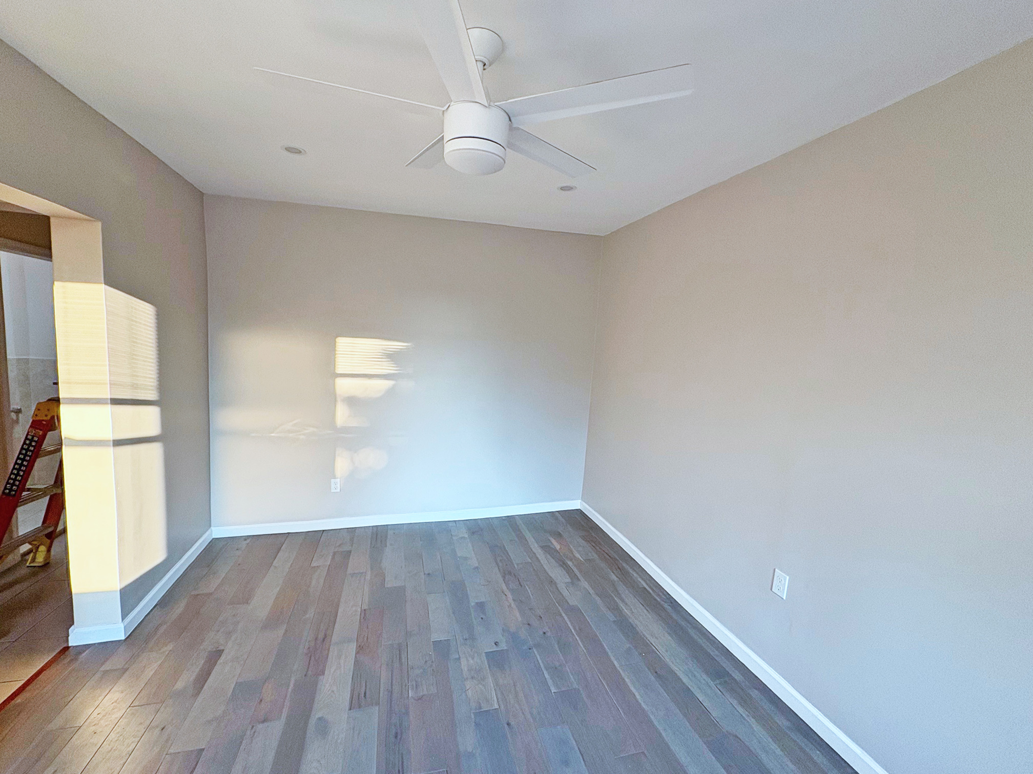 179 Covert Street, Unit 3 Brooklyn, NY 11207 - Photo 10 of 14 a view of empty room with wooden floor and fan